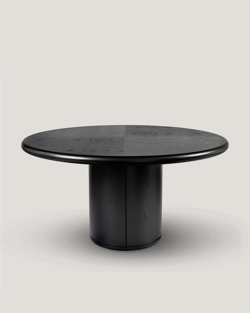 Black oak Moon round dining table with cylindrical pedestal base
