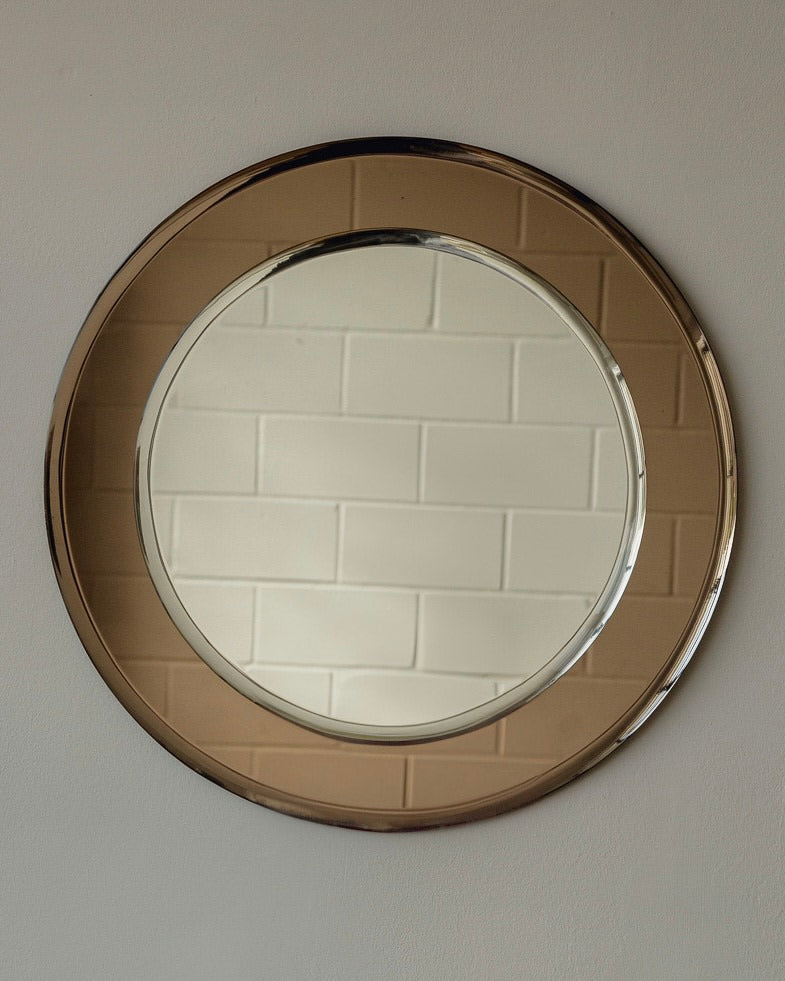 Bronze-tinted round Italian mirror with wide metallic frame detail