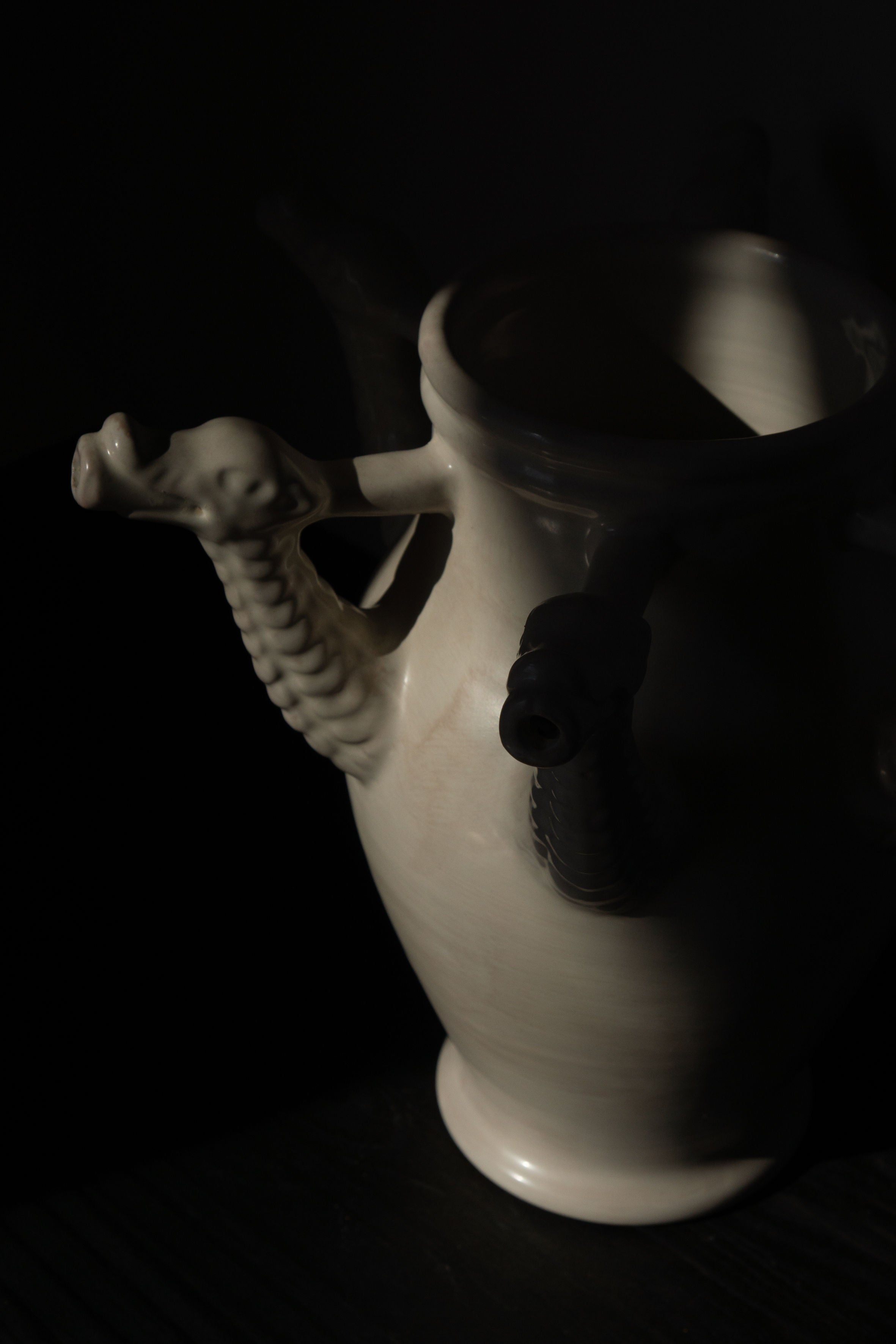 The Drago Bianco - Minimalist Vase in Ceramic — side angle with ceramic texture and dragon handles