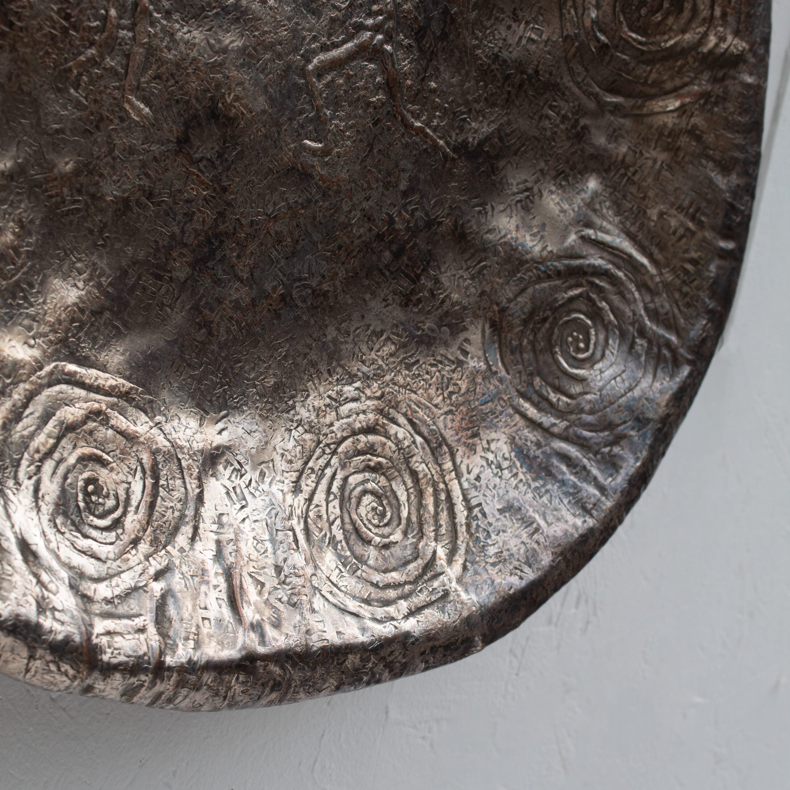 Bragalini Wall Art with Spiral Relief Motif in Hammered Metal — close-up