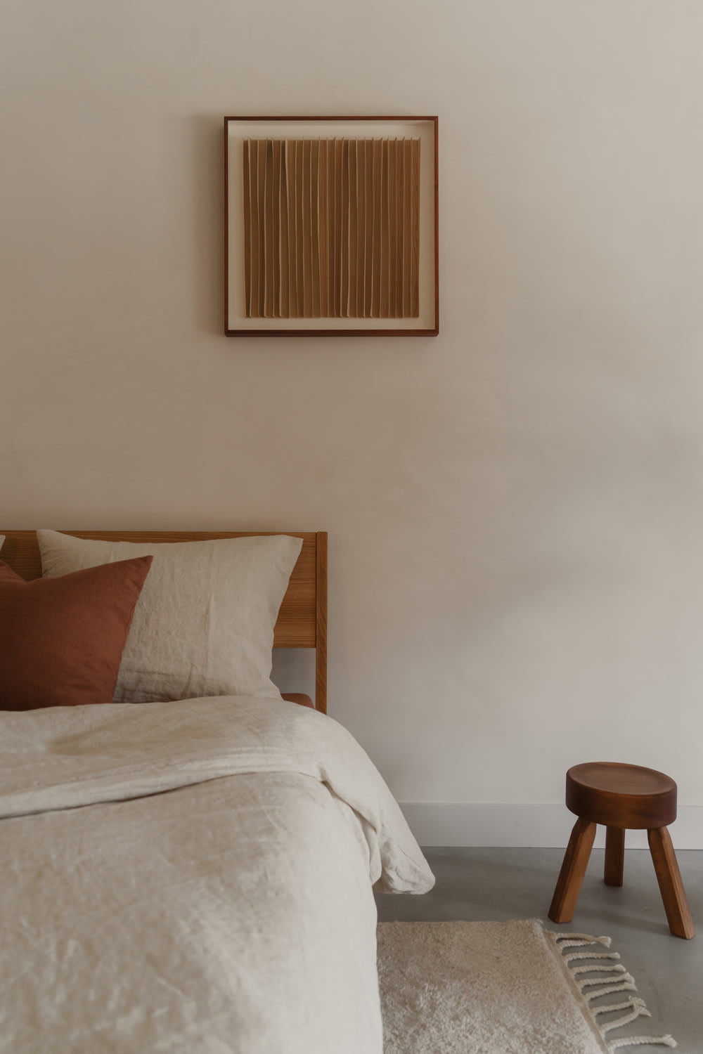 Rhythm Wood' Artwork in Ash Veneer — hung above bed in neutral bedroom setting