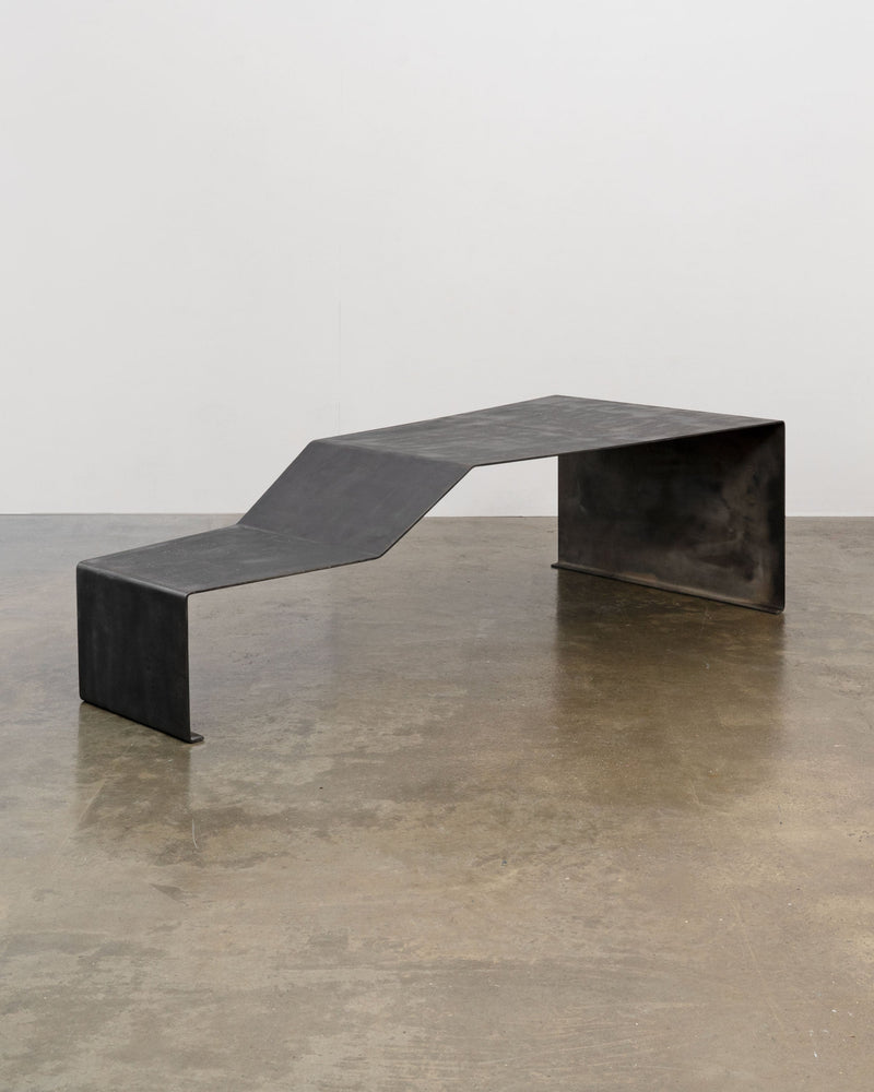 Large patinated steel bench coffee table by Tom Bogle profile view