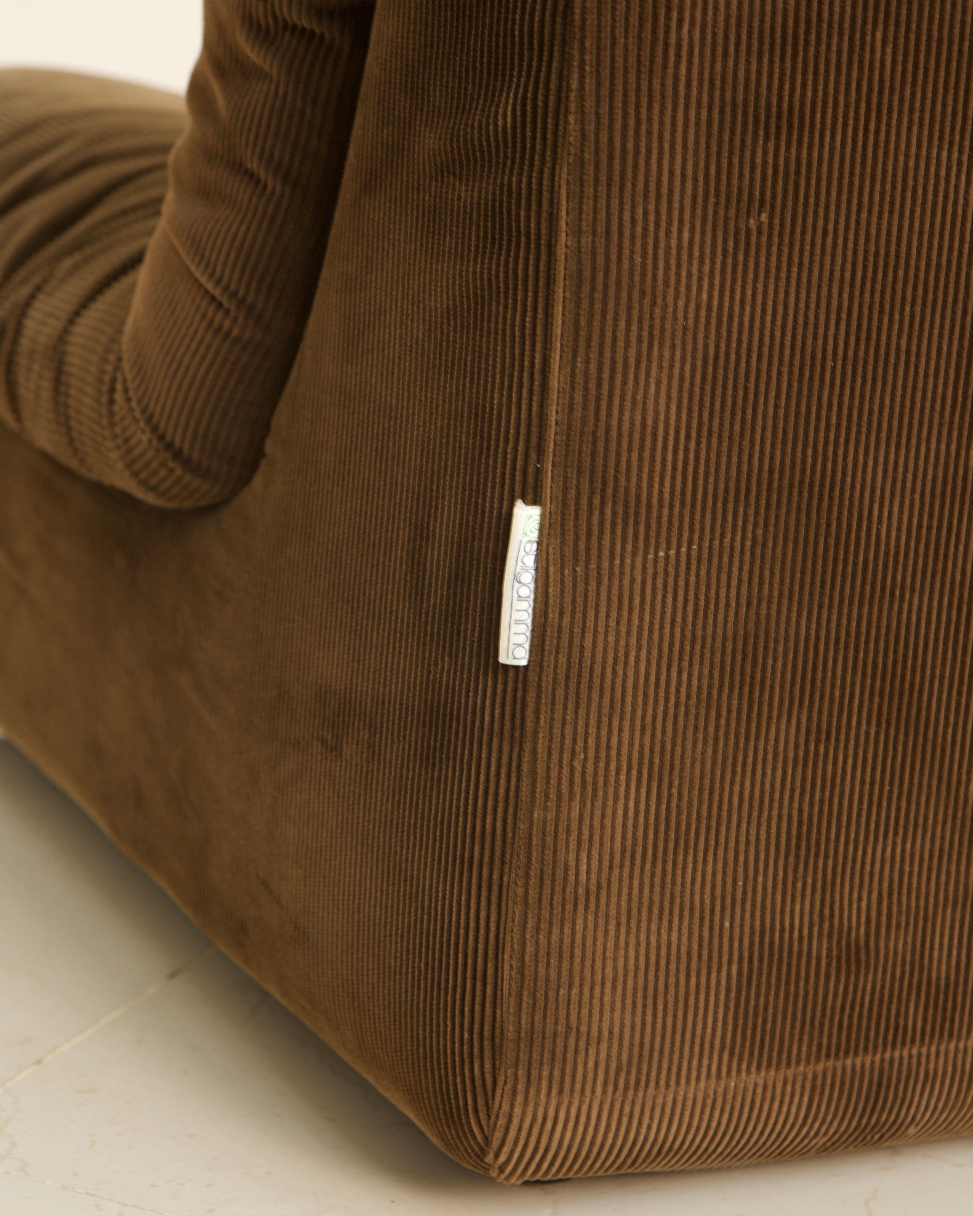 Brown corduroy modular sofa fabric detail with brand label