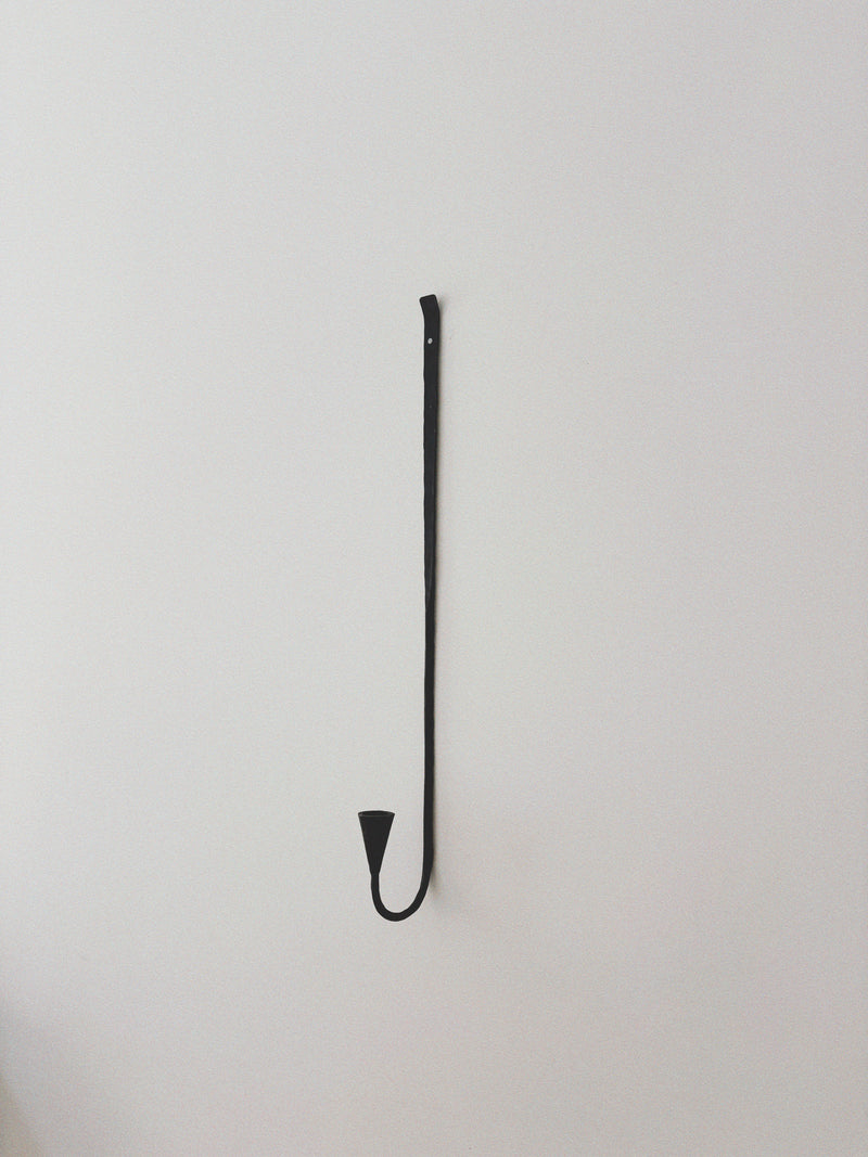 Set of 3 Large Danish Wrought Iron Wall Candlesticks, c. Late 1990s — close-up of black wrought iron candlestick on wall