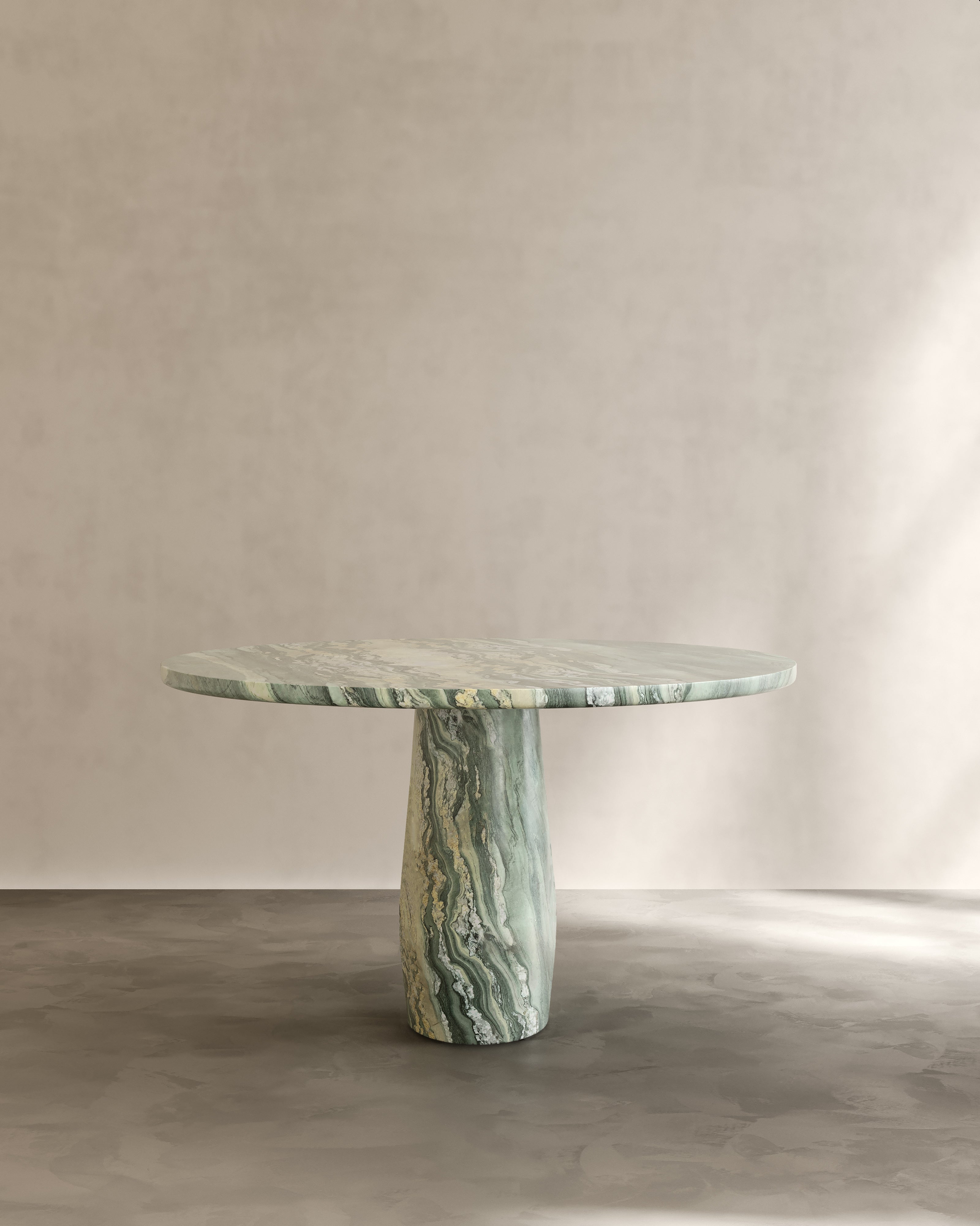 Raffaella Table II — round green marble table in minimalist setting