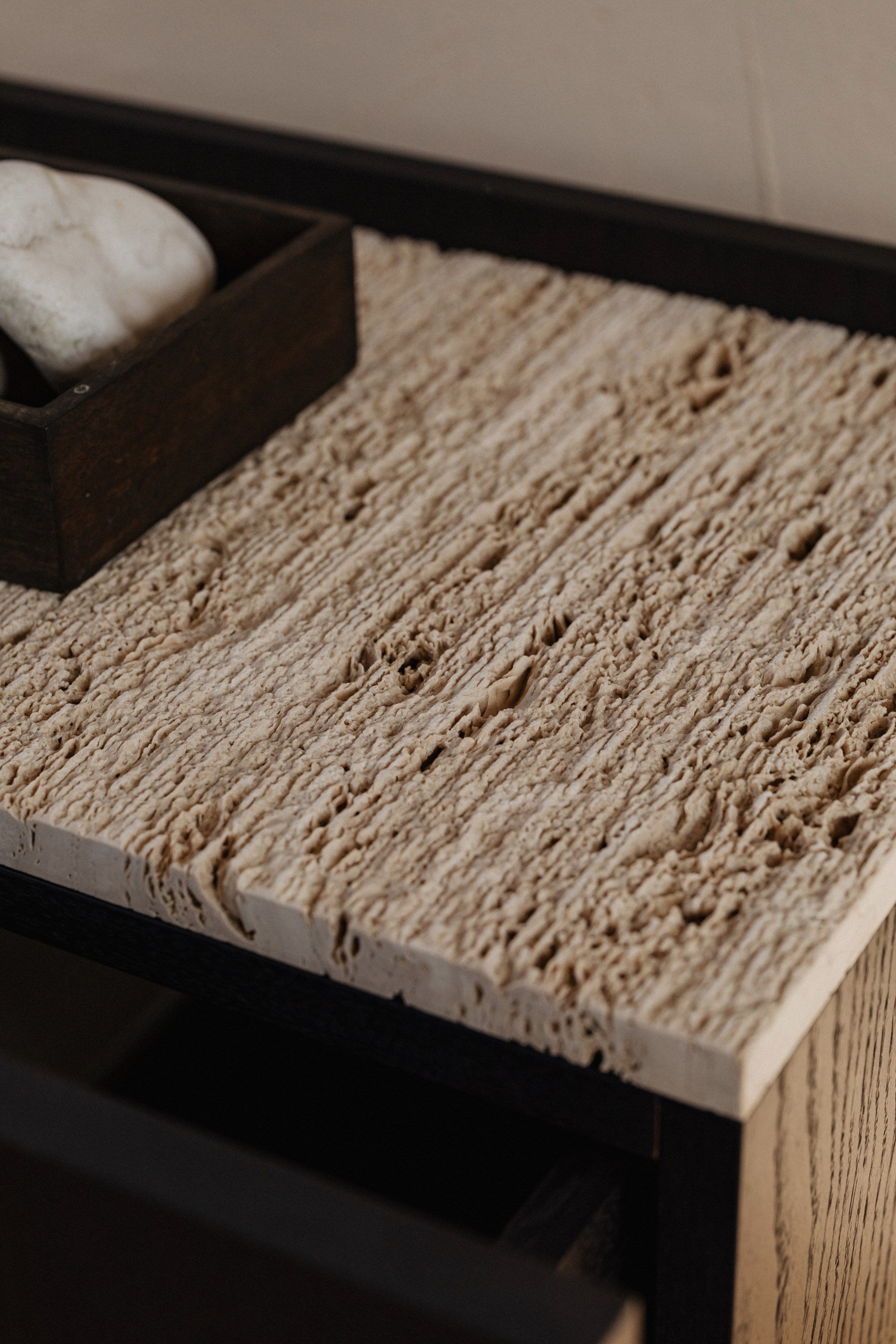 Textured wood surface detail of NOTO nightstand corner