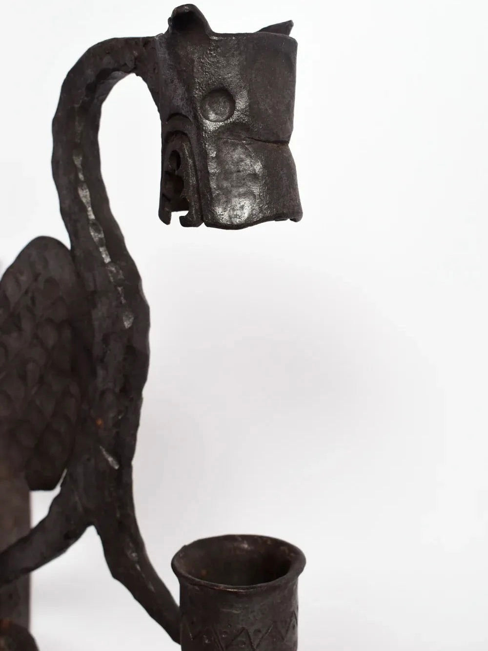 Pair of Mural Candleholders, France, 1960s — angled view of black metal design