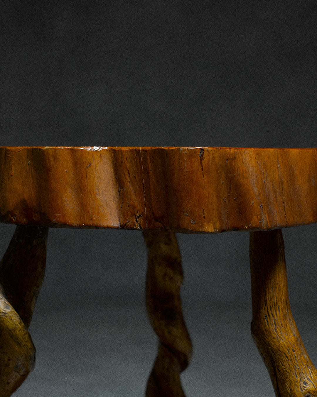 Small Tripod Stool — close-up of wooden seat edge with natural grain