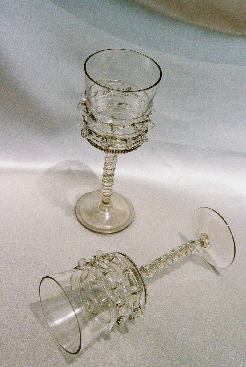 Pair of Mouthblown Wine Glass - Tall Spirals — close-up of transparent glass with spiral design