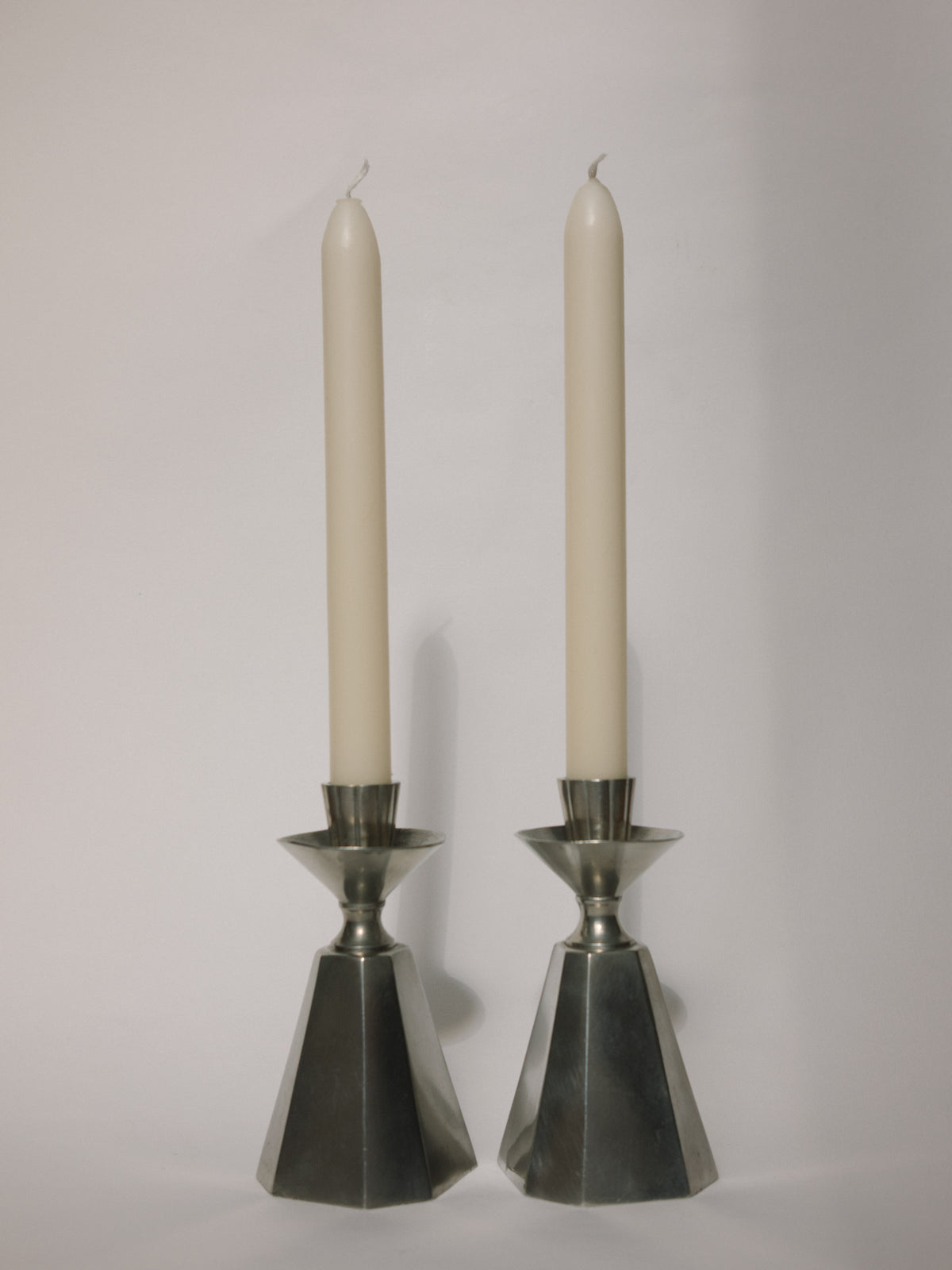 Pair of GAB Tenn Faceted Pewter Candlesticks | Sweden 1960 — lifestyle setting