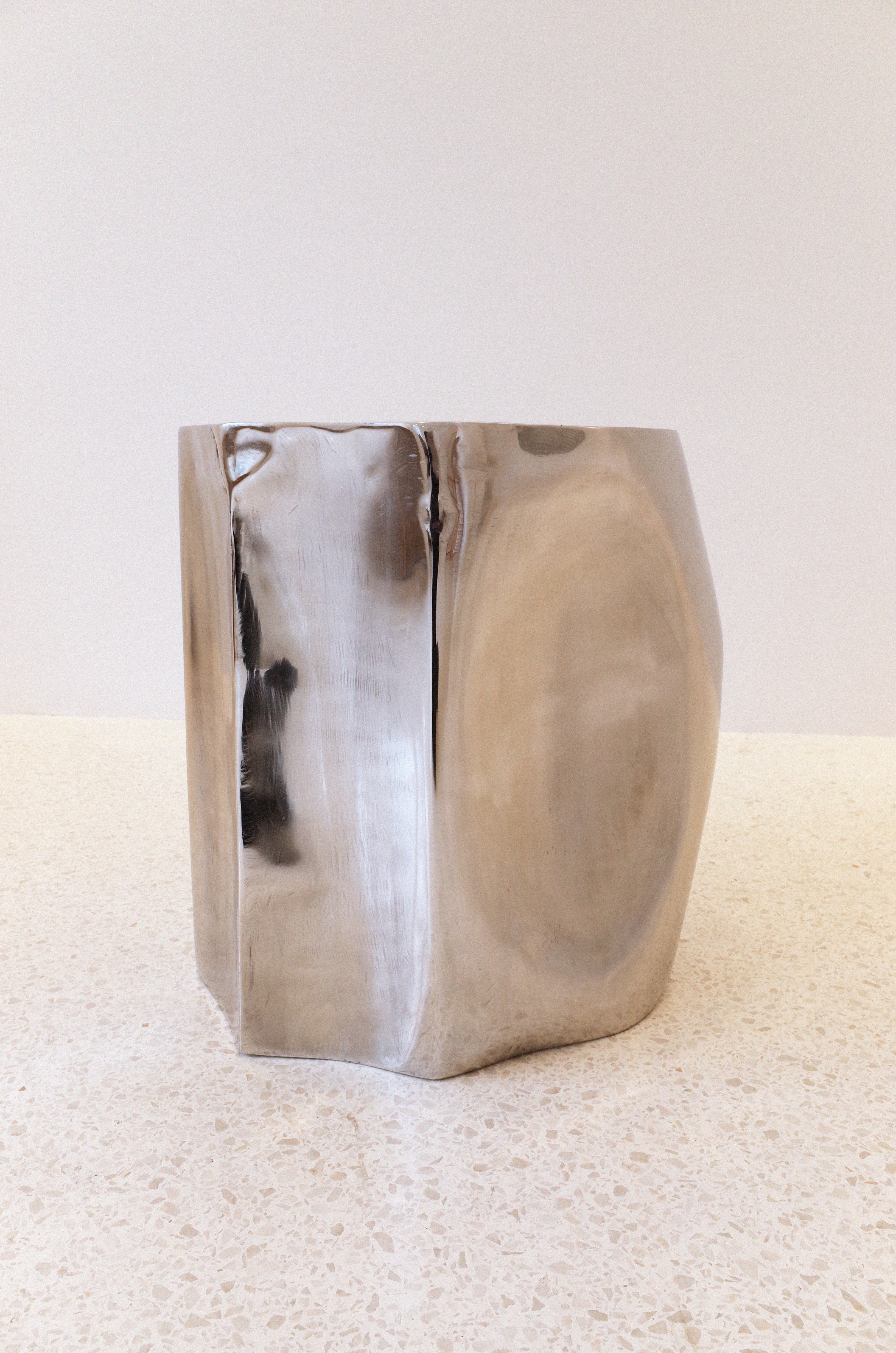 The ROCHER Small Table in Polished Stainless Steel