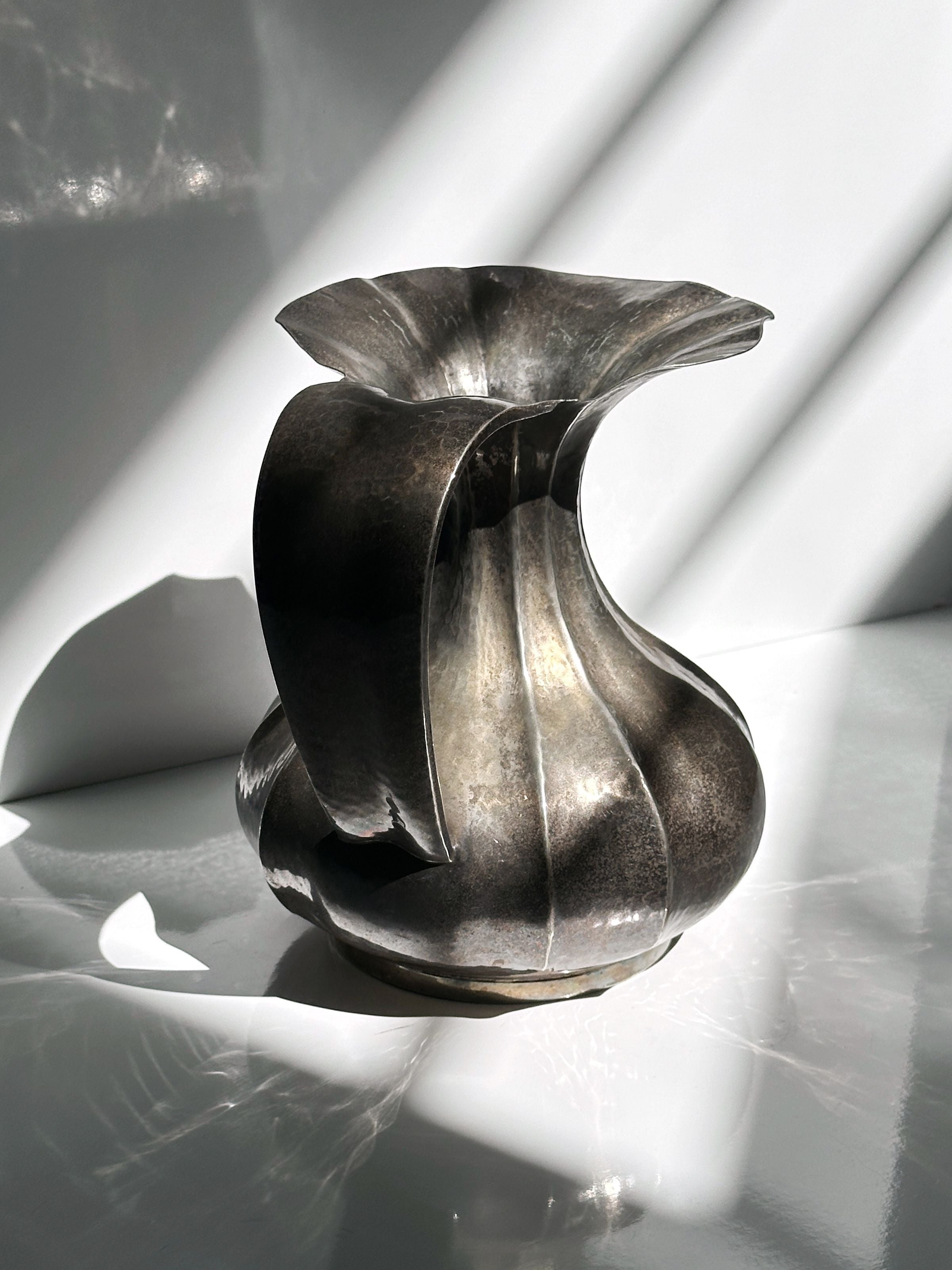 Silver-plated twisted metal vase with Art Nouveau flowing curves