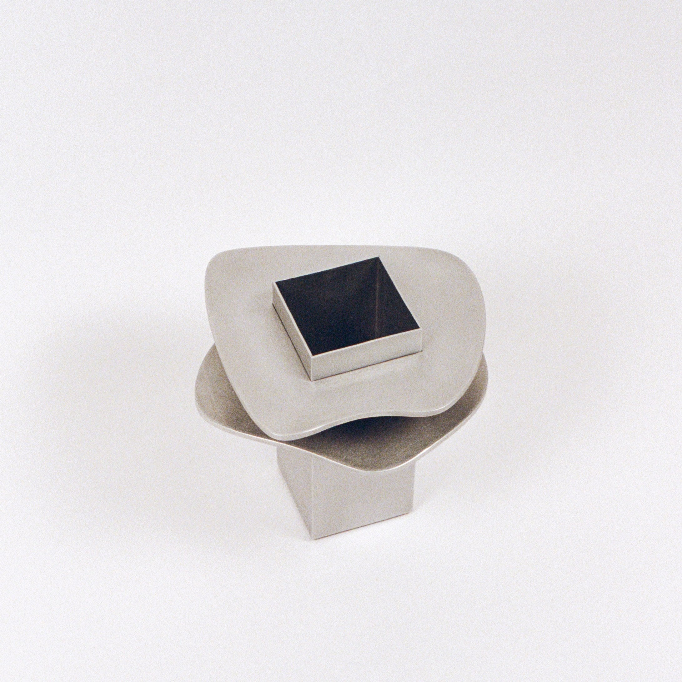 Flange Vase — top view of brushed metal design