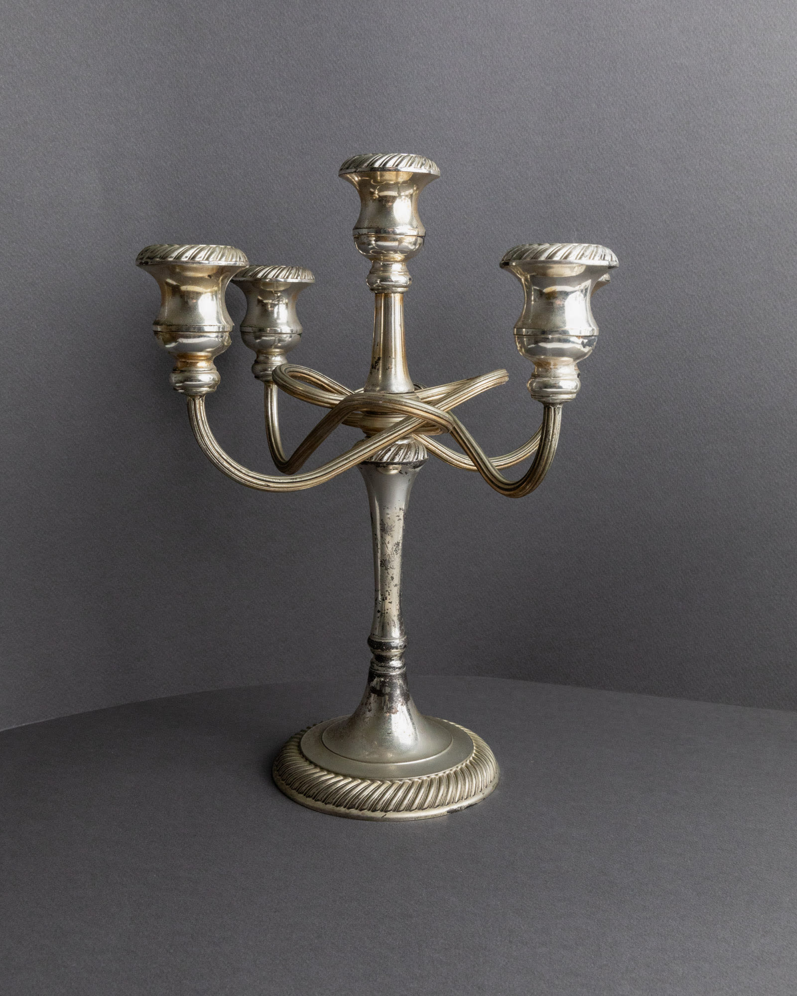 Vintage 1950s Silver Plated Candleholders, Set of 2, Large Five Arm Curved Design — side angle showing polished silver surfac