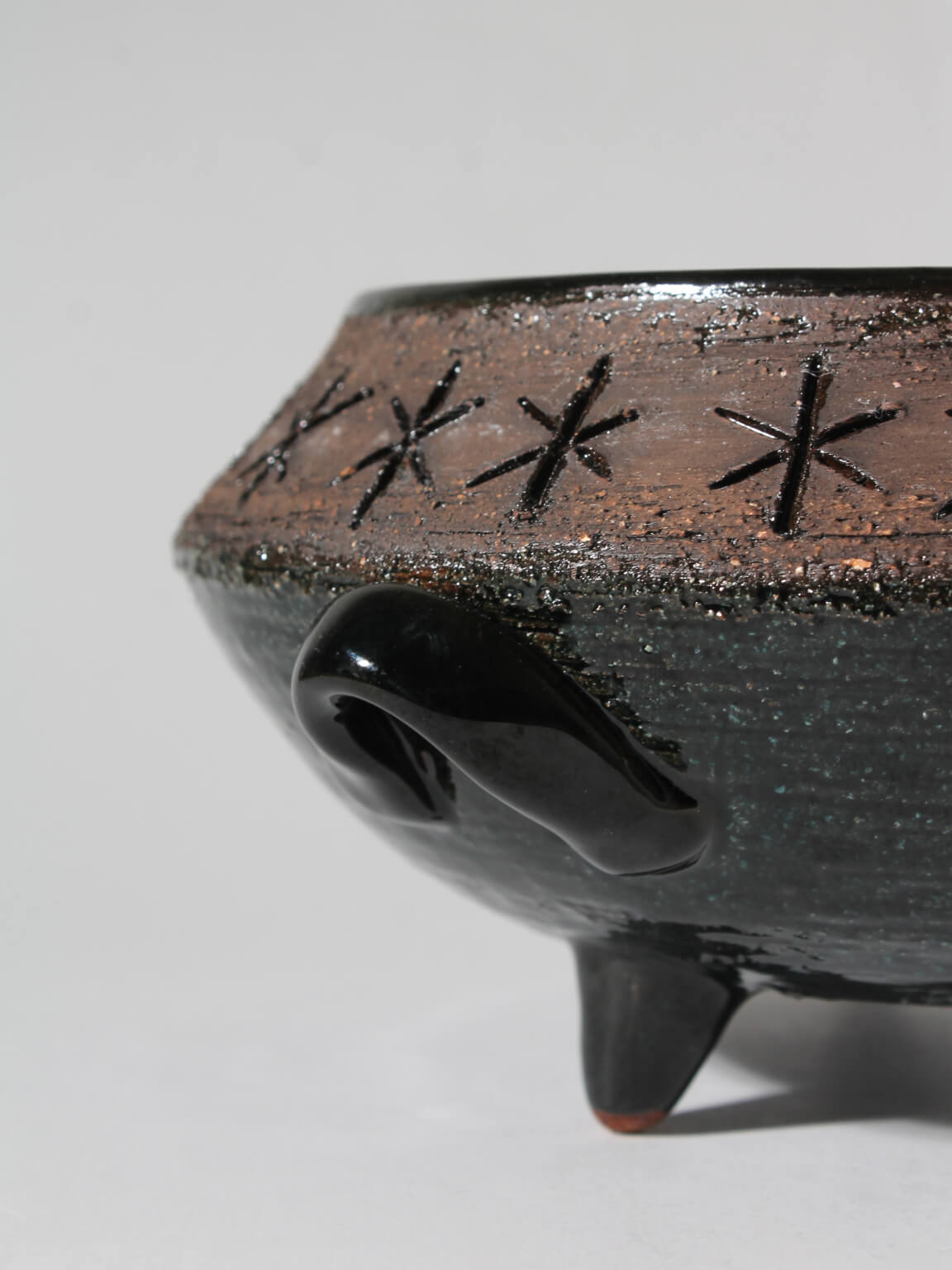 Eke Bjerén Swedish Ceramic Bowl On Legs — close-up of black ceramic with decorative pattern