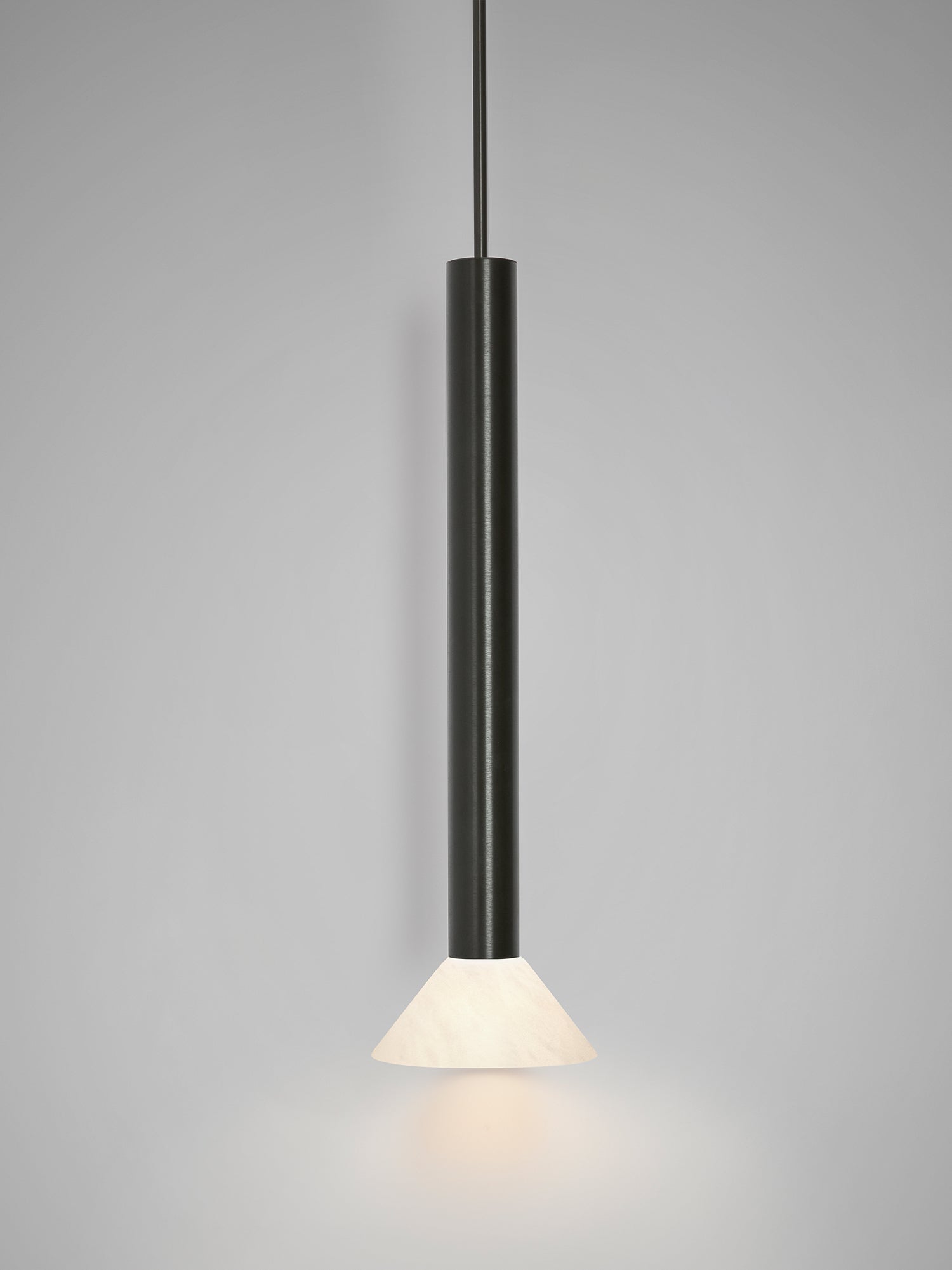 TORRES Pendant Tall — close-up of black metal and white glass shade