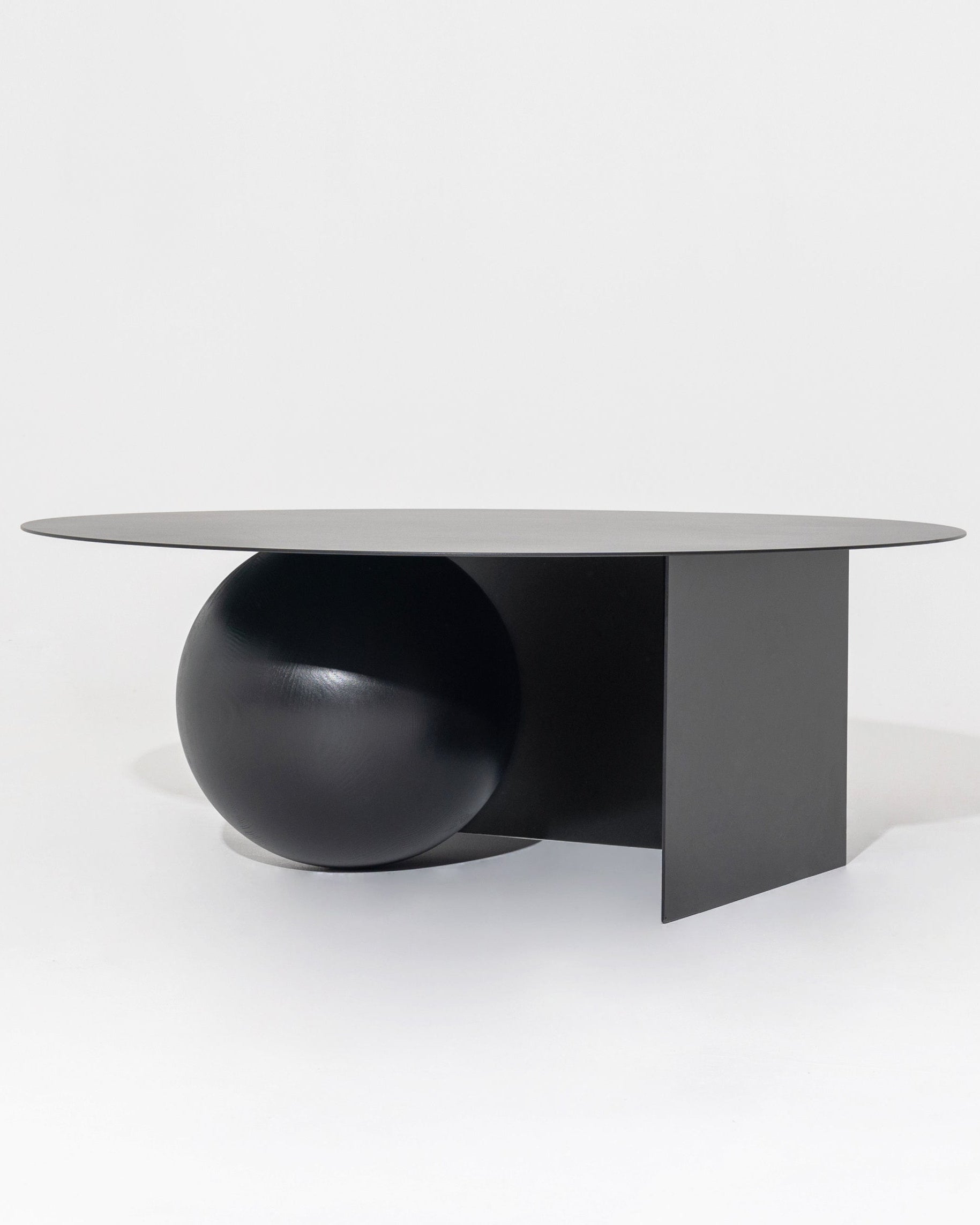 FUKU Coffee Table — close-up of black round base and tabletop