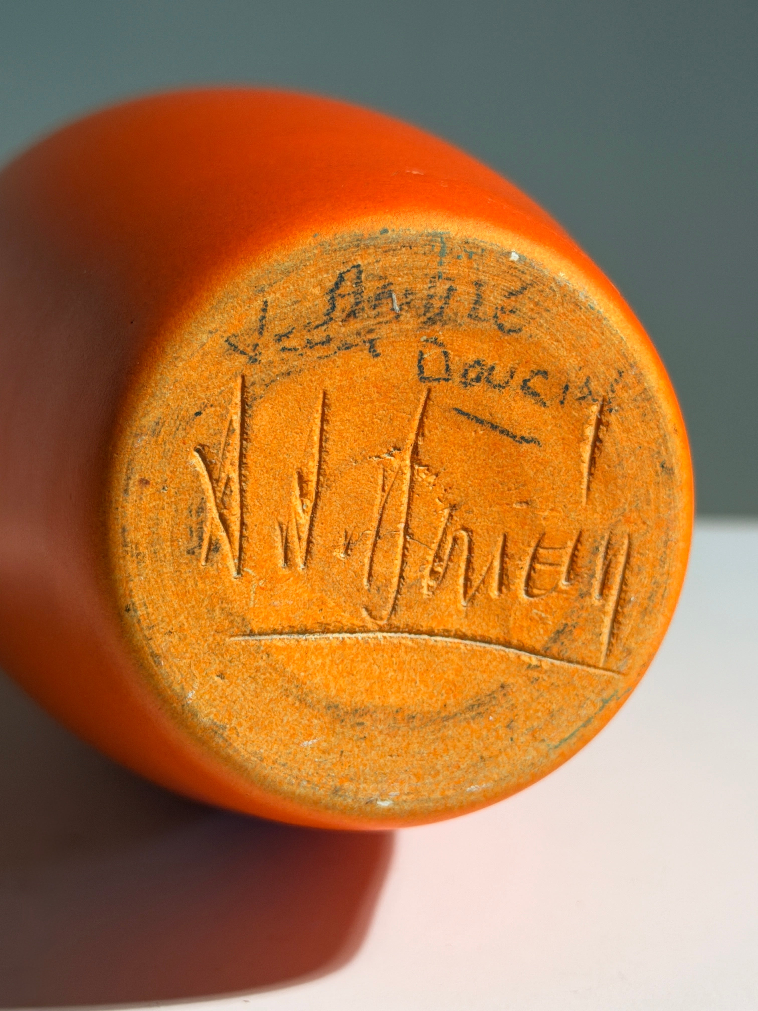 Large orange soliflore bottle vase by André-Jean Doucin, circa 1950 — in context