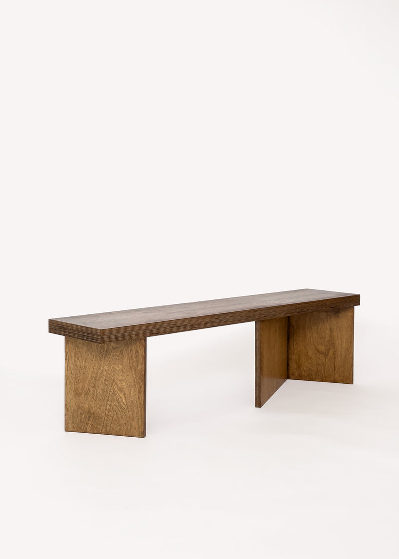 The Free plan Bench by GOONS features a minimalist, customizable design with a flat rectangular seat and two wide legs—ideal for modern architecture furniture lovers. Shown here against a plain white background.