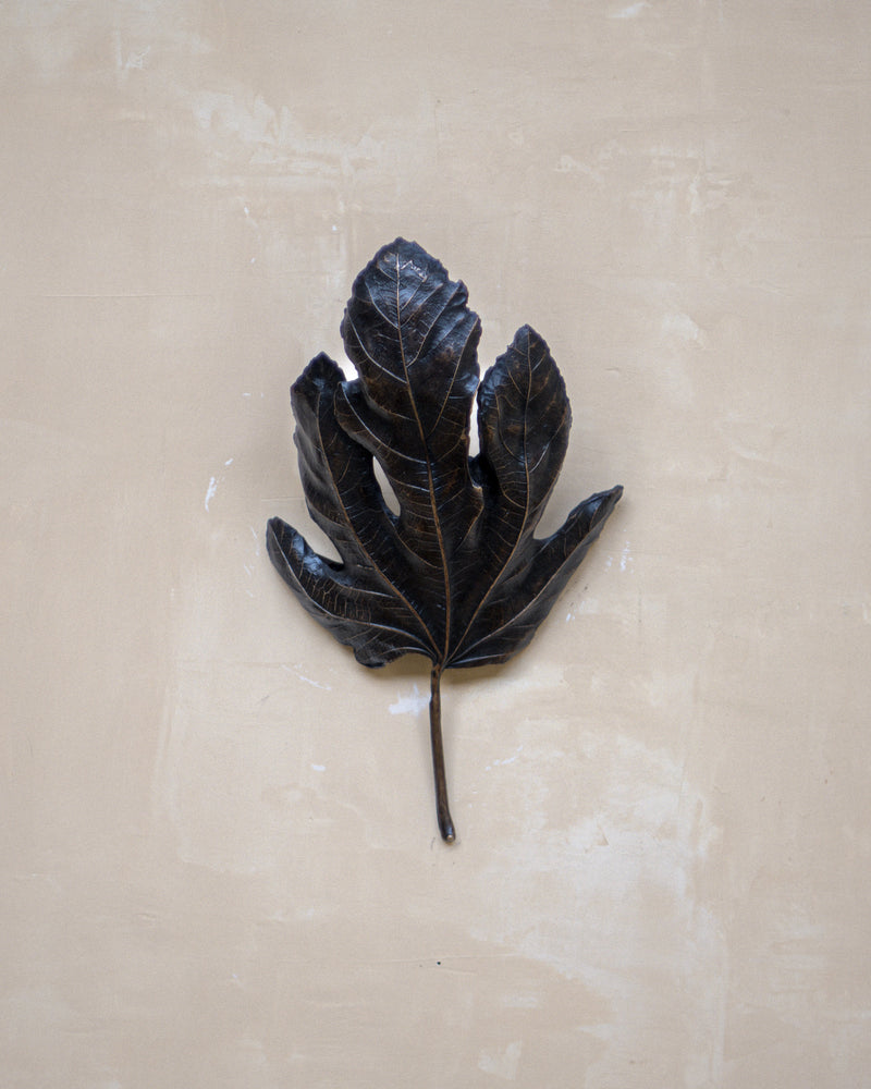 Bronze fig leaf wall light detail showing intricate leaf veining
