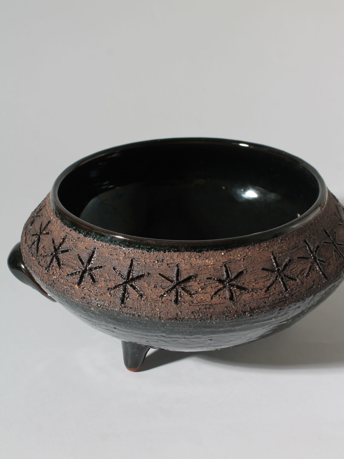 Eke Bjerén Swedish Ceramic Bowl On Legs — top view showing textured brown and black surface