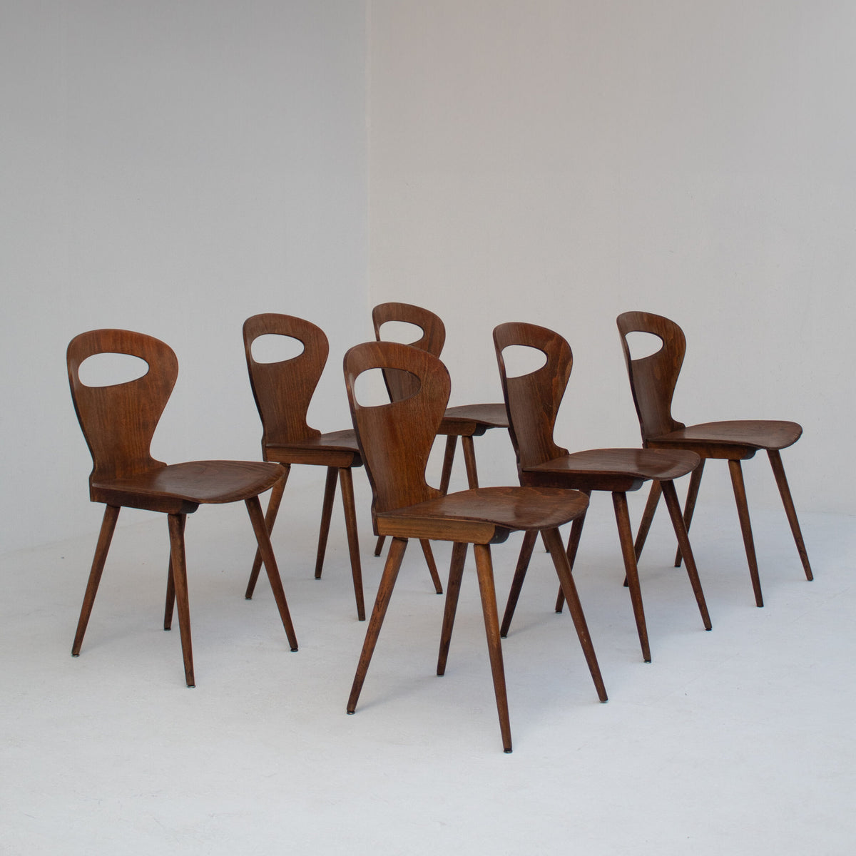 Set of Six Sculptural Wooden Dining Chairs — side angle