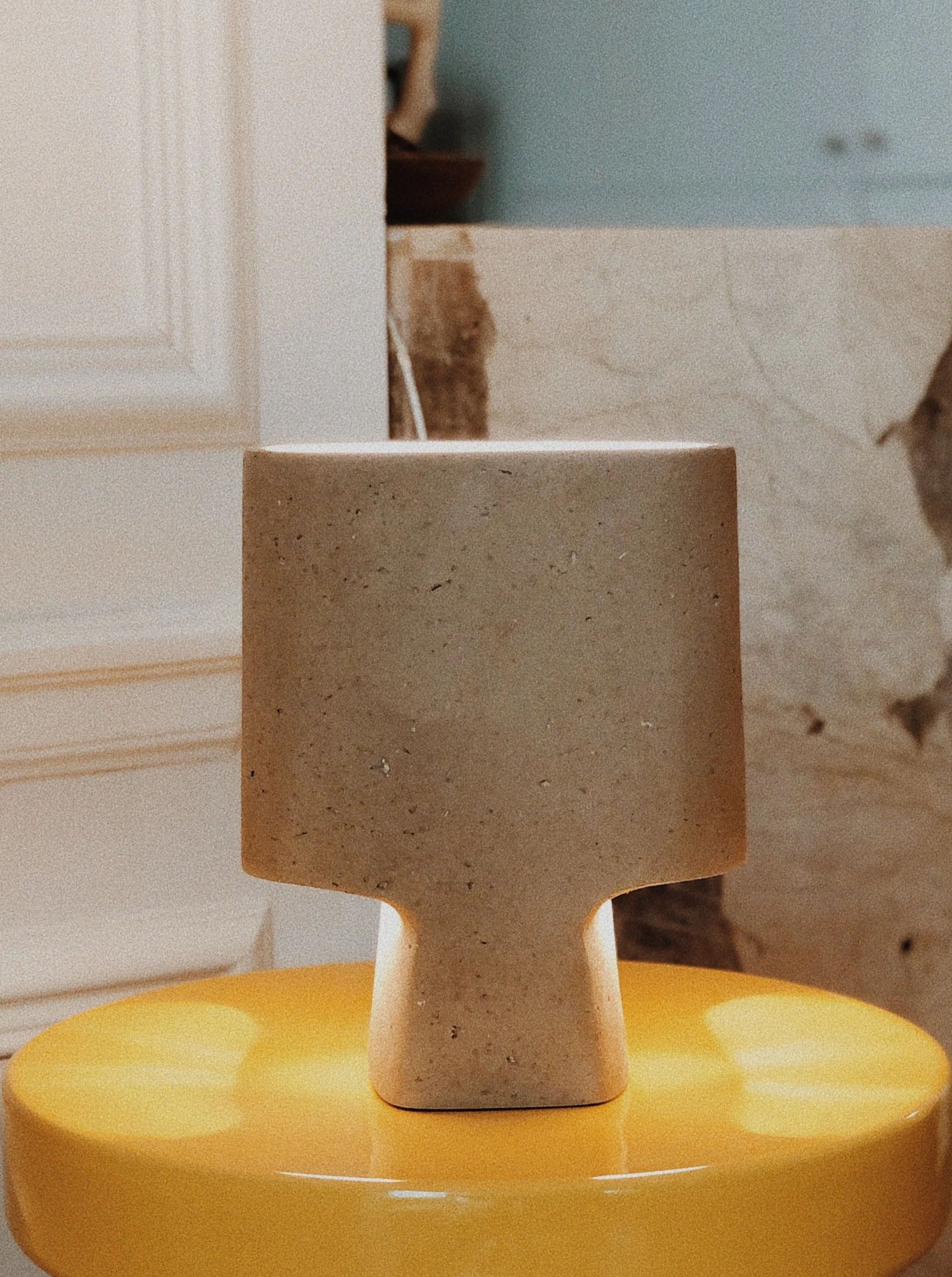 Lamp Bien Faite Taupe — positioned on yellow side table in bright room