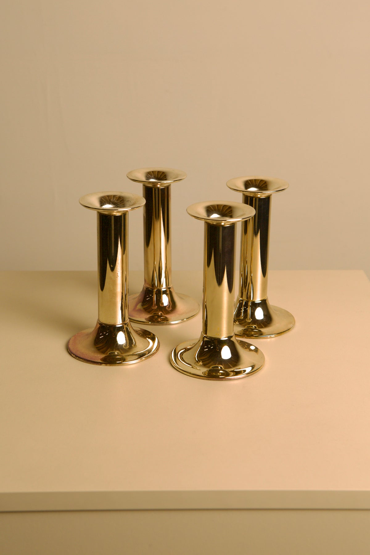Set of 4 Italian silvered metal candle holders, 1970s — in context