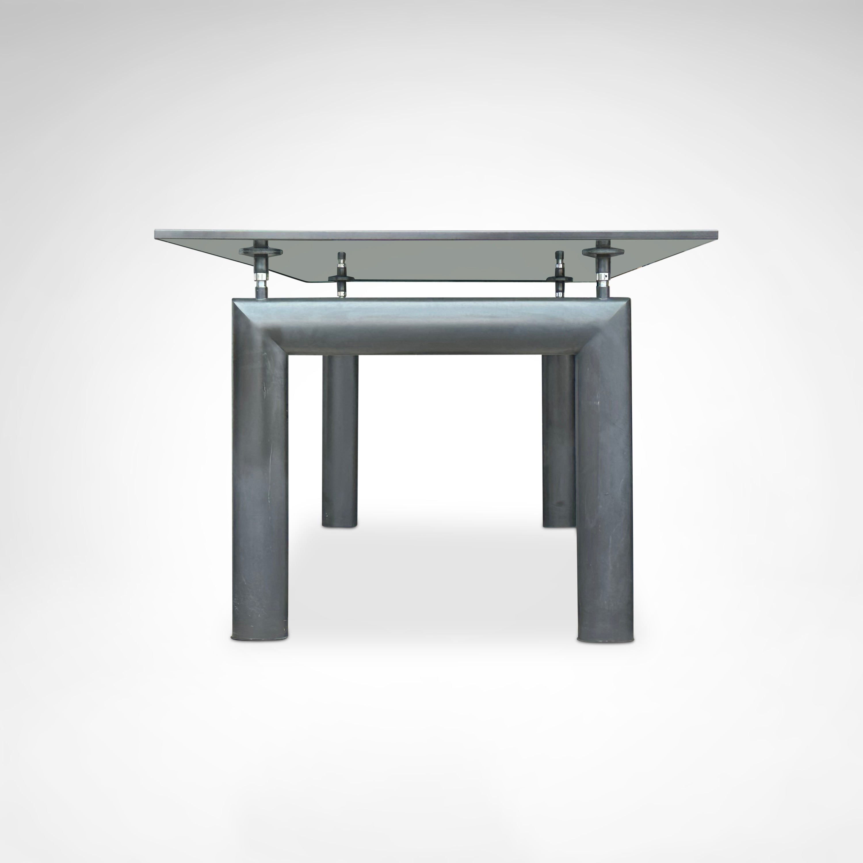 LC6 Dining Table by Le Corbusier et al. for Cassina 1990s — front view highlighting glass top and metal legs
