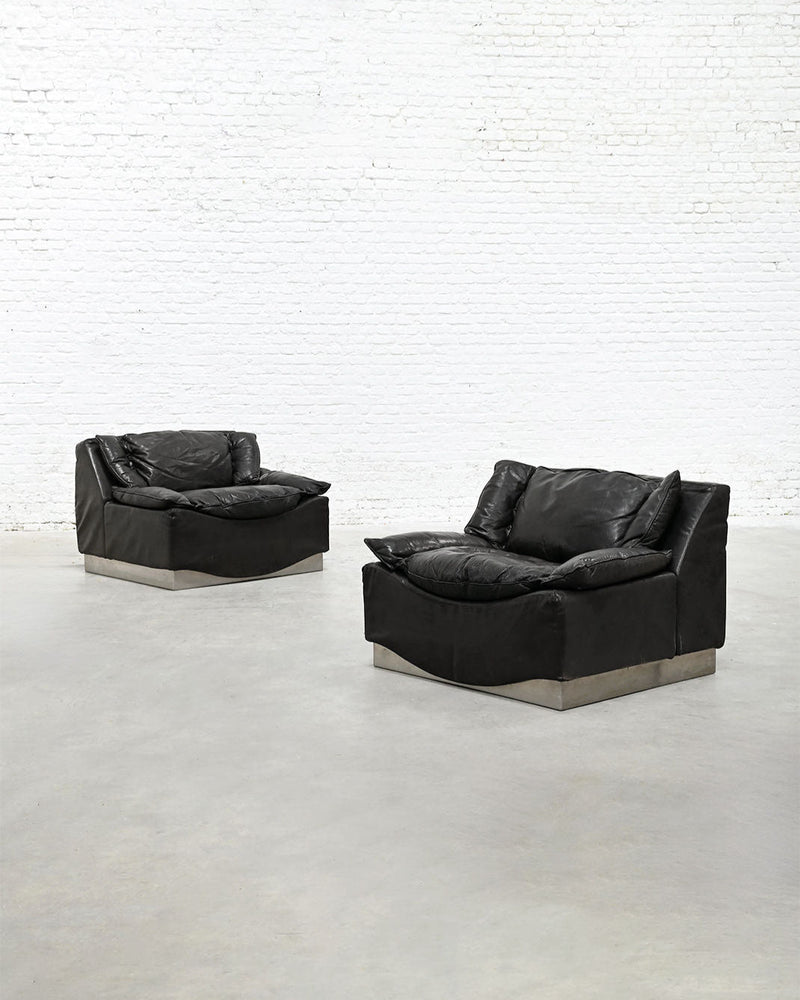 Pair of black leather armchairs with steel bases by Frigerio