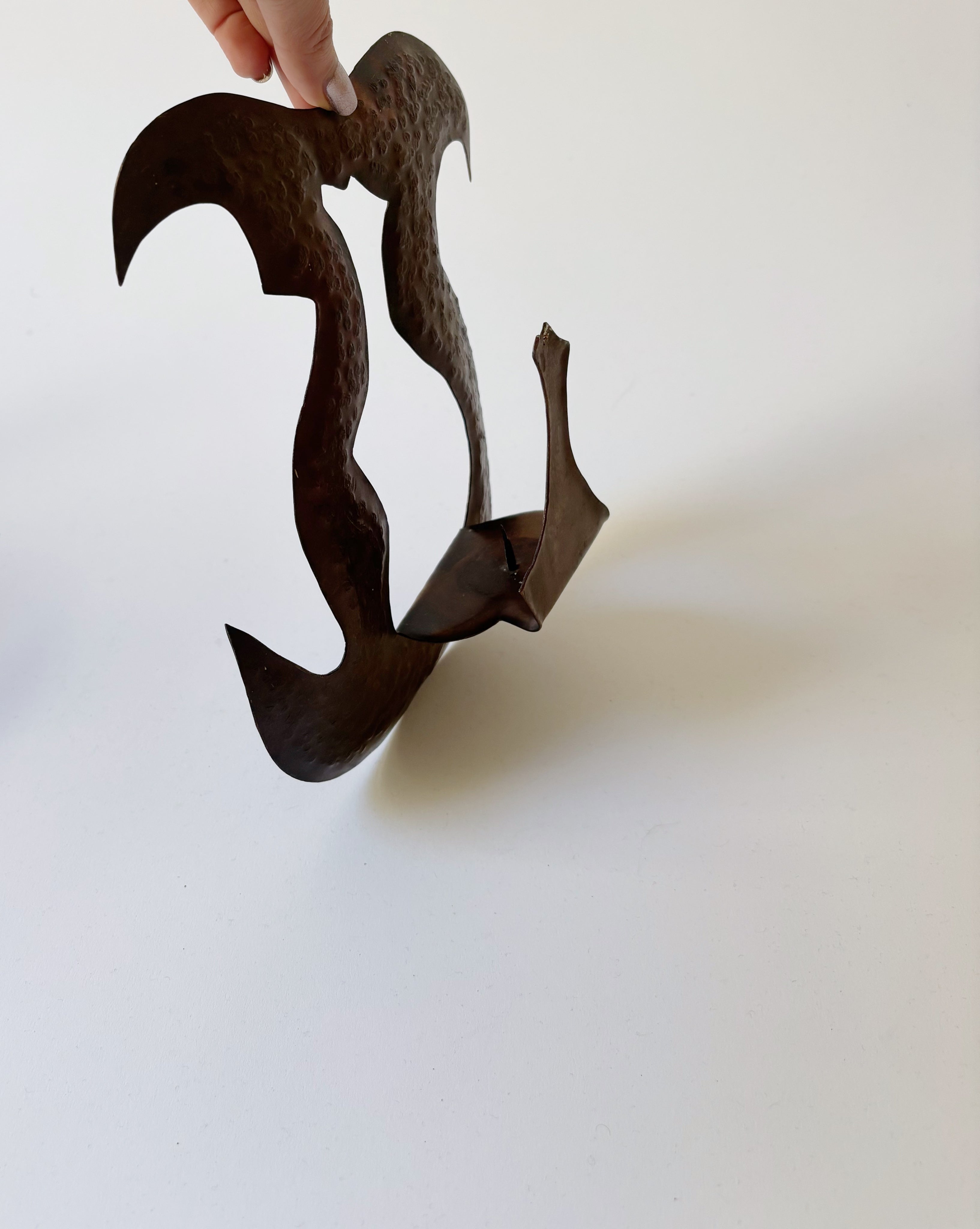 Pair of Torch Cut Metal Wall Candleholders, Poland — close-up
