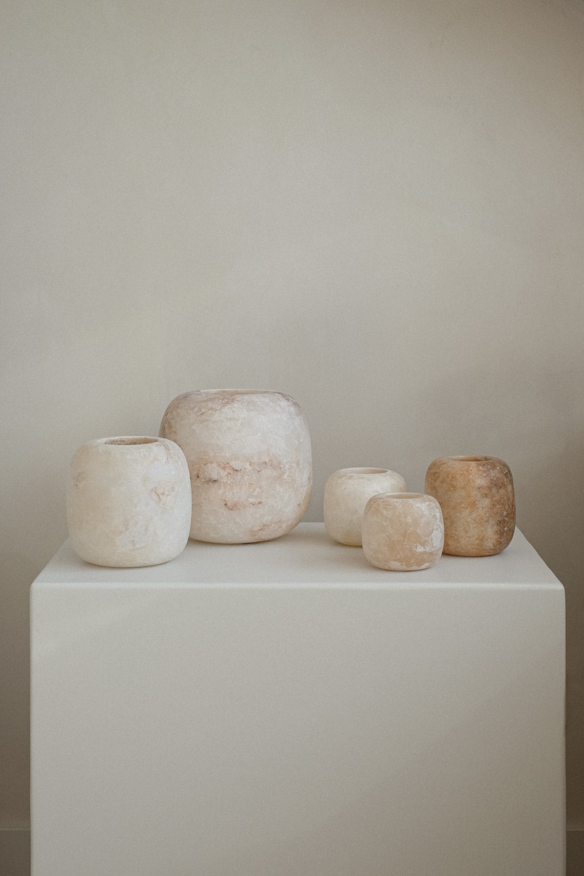 Alabaster Candle Holder — arranged on white pedestal with neutral background