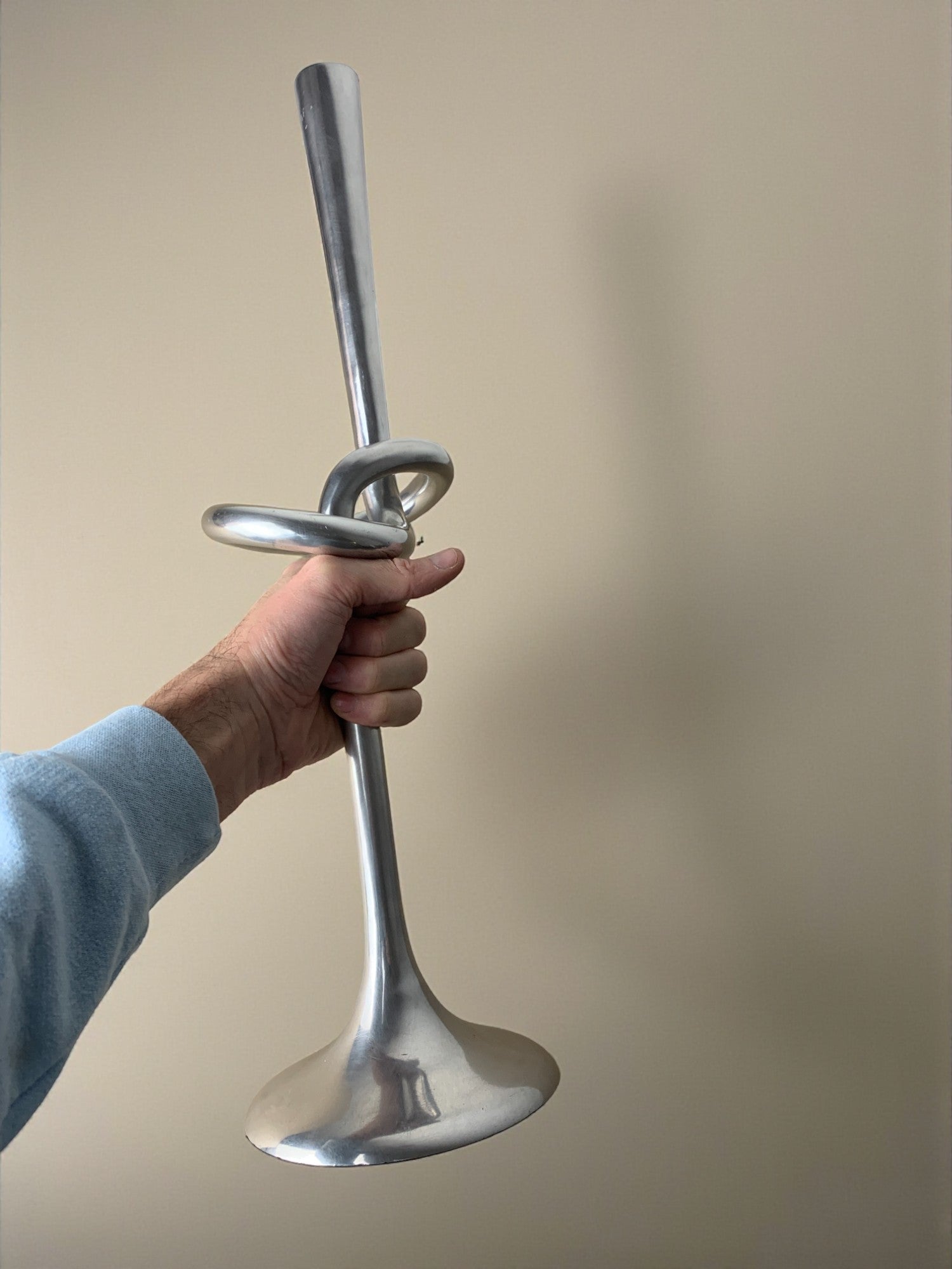 XL knotted candlestick in Solid aluminum, Italy, 1980 — side angle