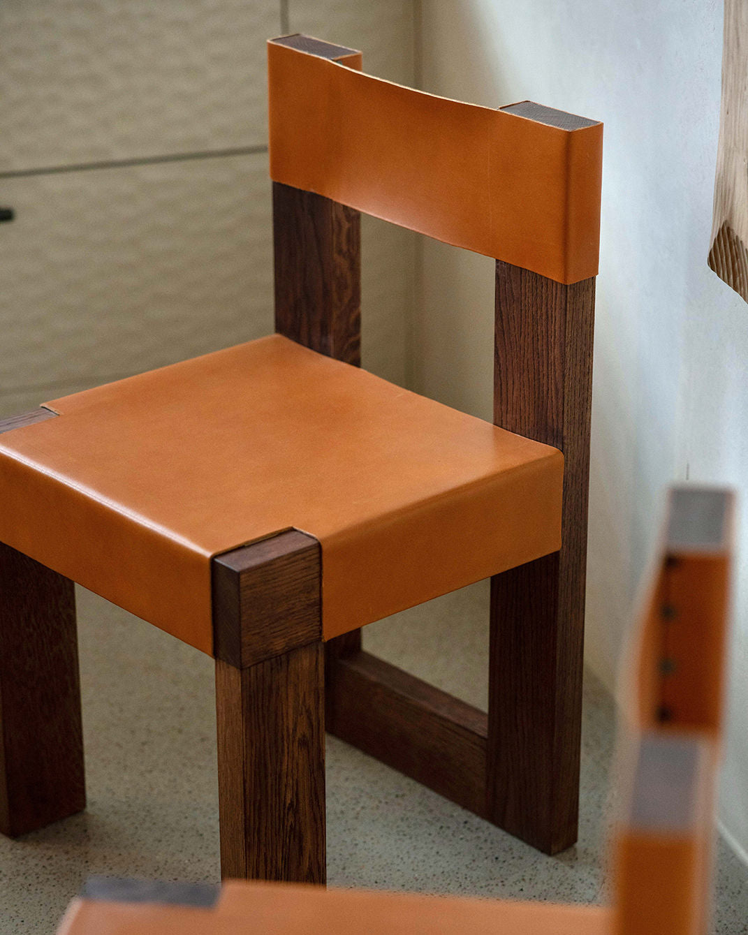 Chair object118 — back view highlighting tan leather and wooden frame