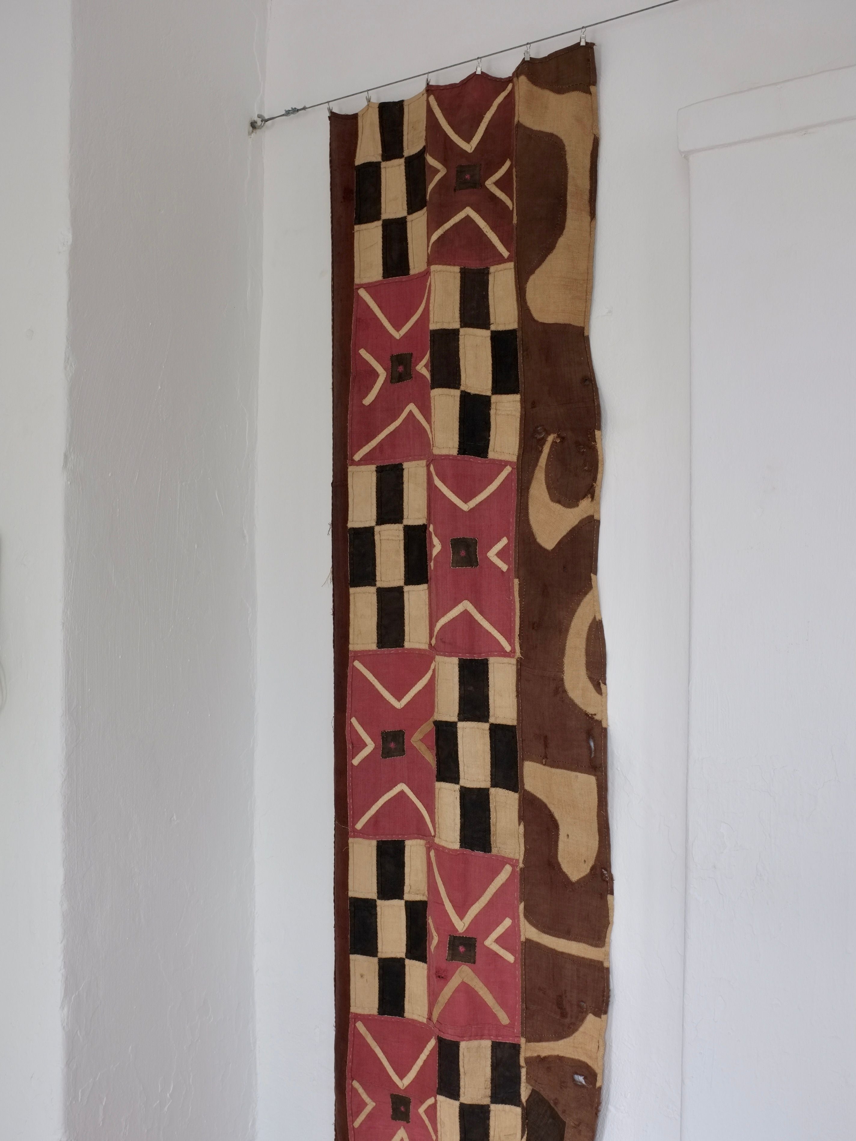 Checkered Textile Wall Hanging, Africa, Mid-Century — side view against white wall