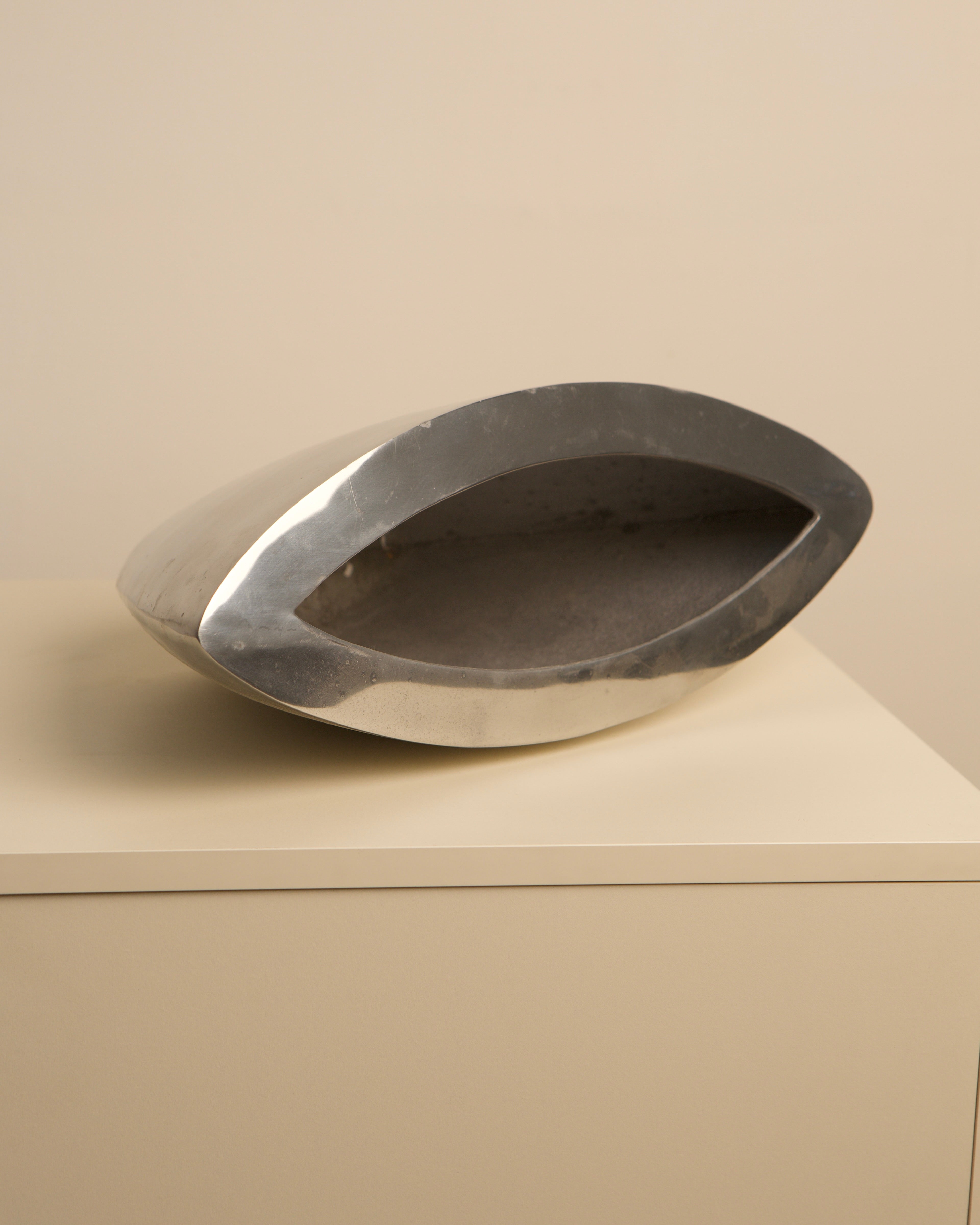 Large Italian metal vase with curved sculptural form, 1980s design