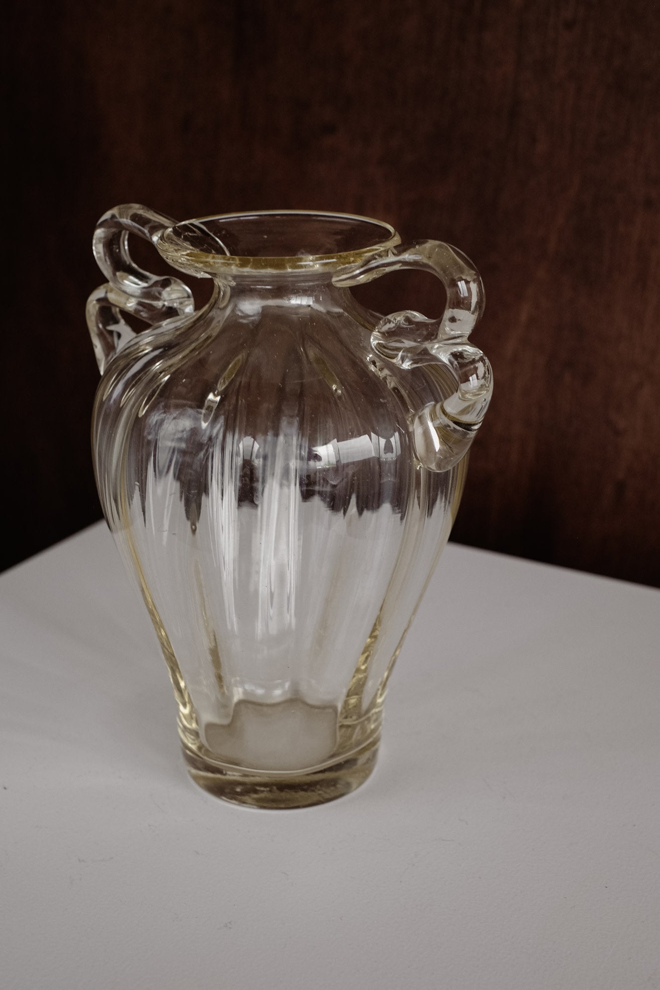 Elegant Handcrafted Glass Vase with Decorative Handles — lifestyle setting