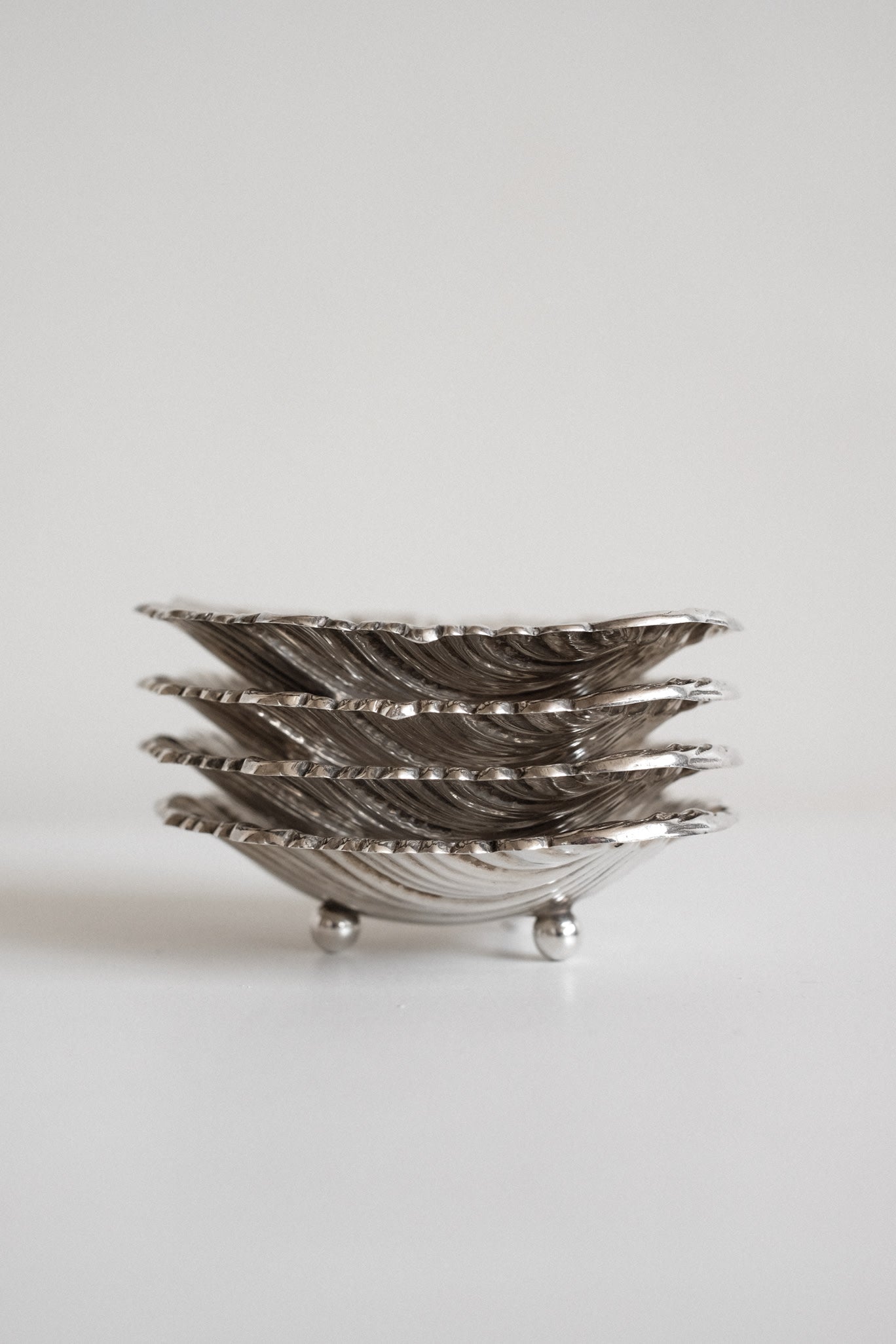 Set of 4 small shell dishes  — close-up