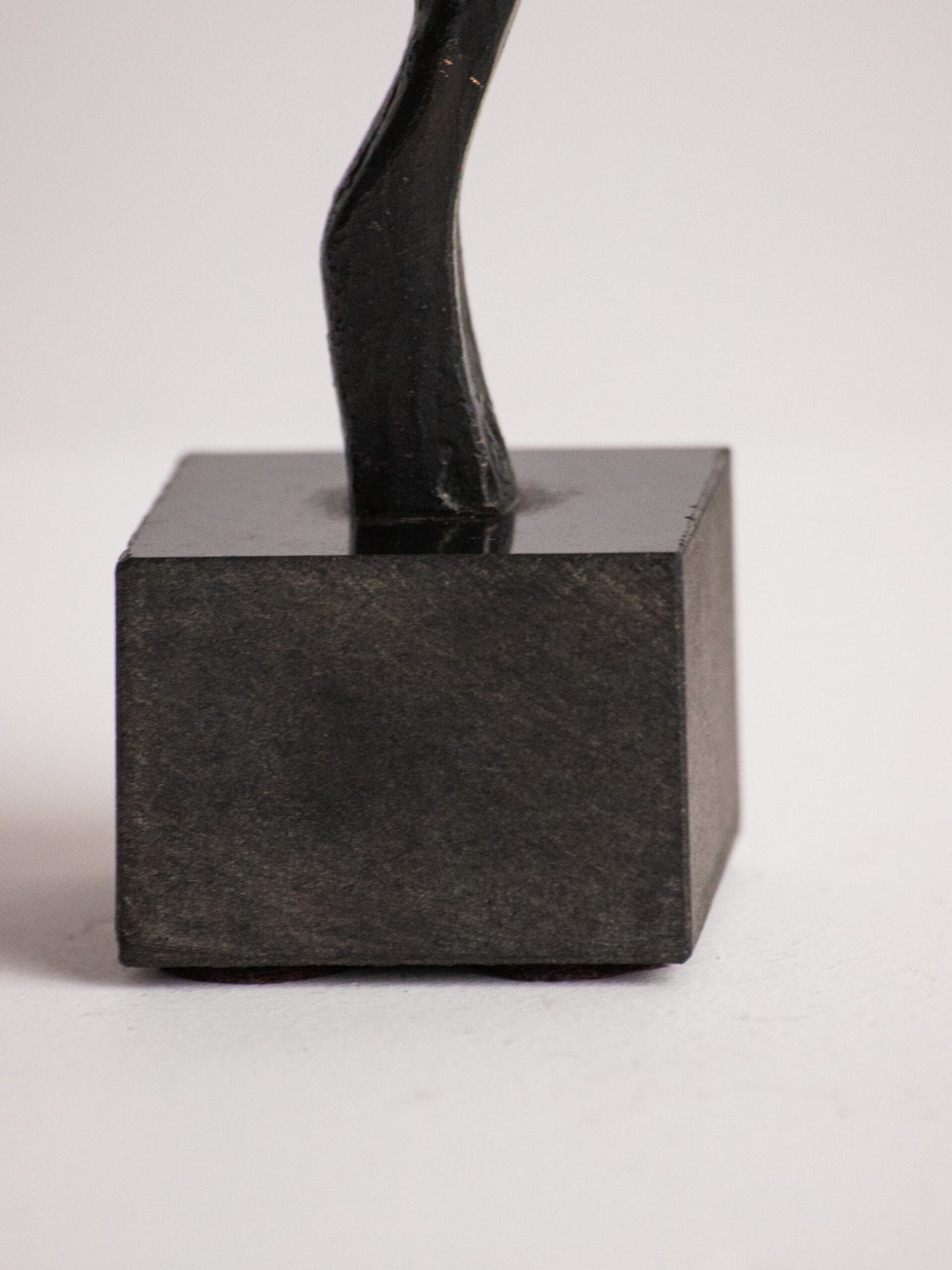 Biomorphic Sculpture in Patinated Metal on a Black Stone Cube, Scandinavian, Late 20th Century — in context