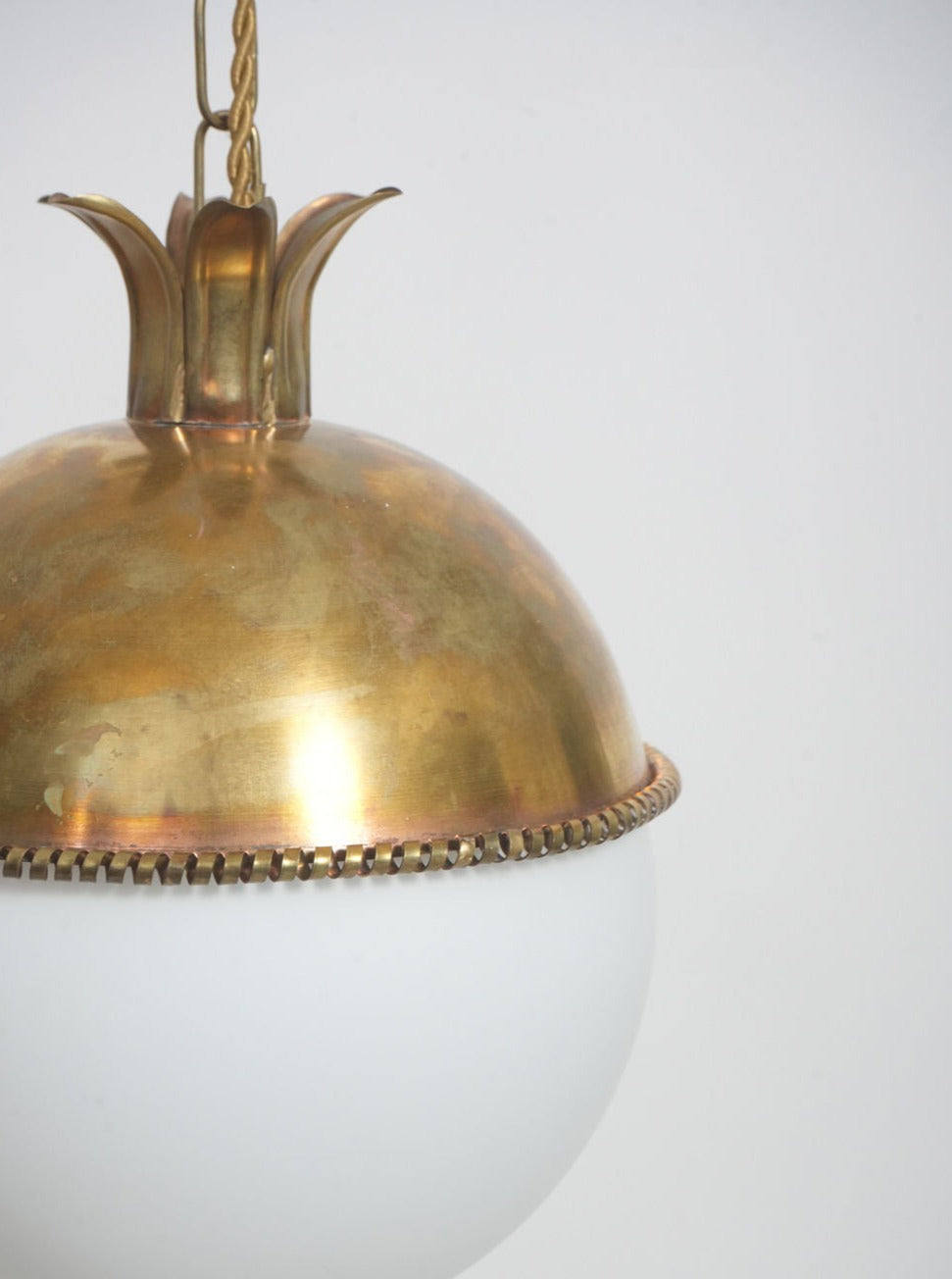 The Granada Ceiling Pendant Lamp by Barracuda Interiors features a vintage brass dome top, crown-like detailing, and a frosted white glass globe shade, shown against a plain white background.