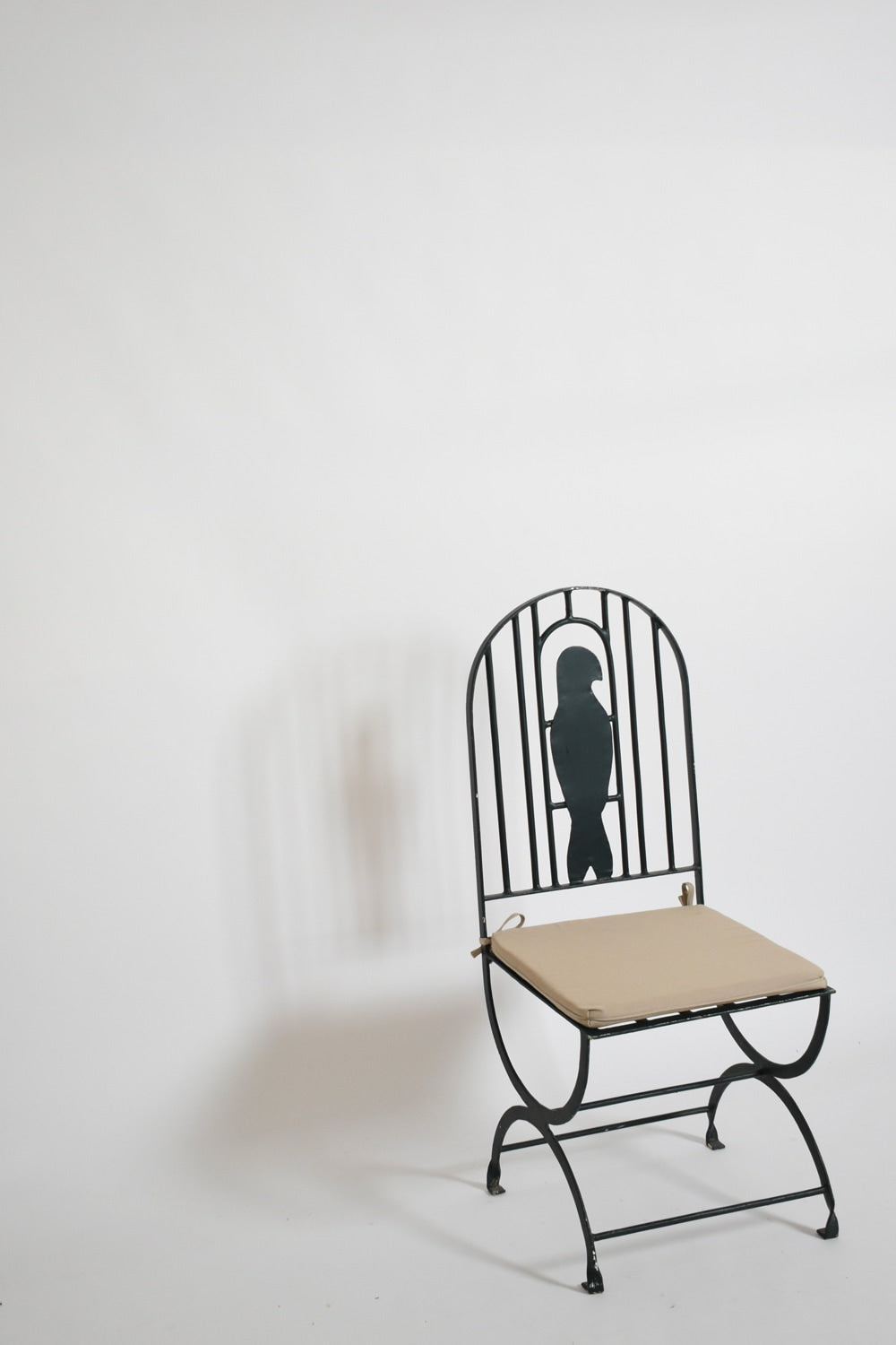 Pair of wrought iron bird cage chairs, 1960s. — detail view