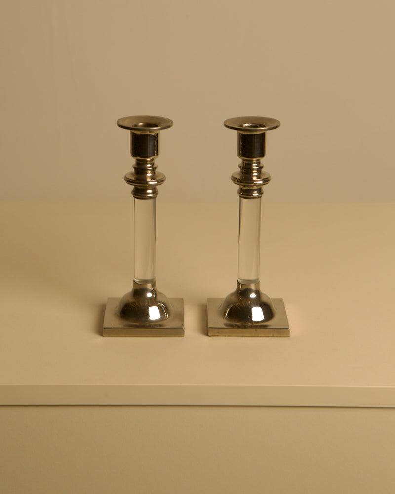Pair of Italian Candleholders in Lucite and Silver-plated Metal, 1980s — close-up of candleholders on neutral background