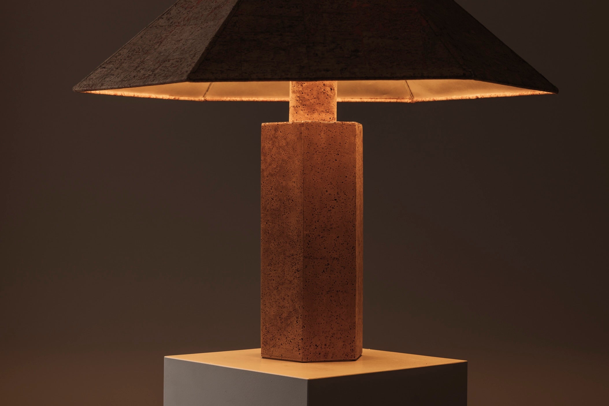 Hexagonal Cork Table Lamp by Ingo Maurer for M Design, Germany 1970s — close-up of cork base with warm light