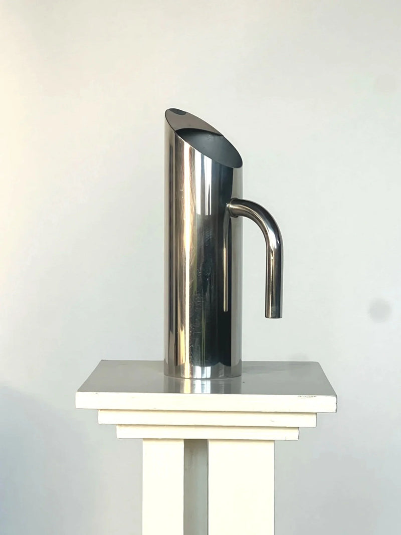 Sculptural Polished Water Jug — side view highlighting stainless steel finish