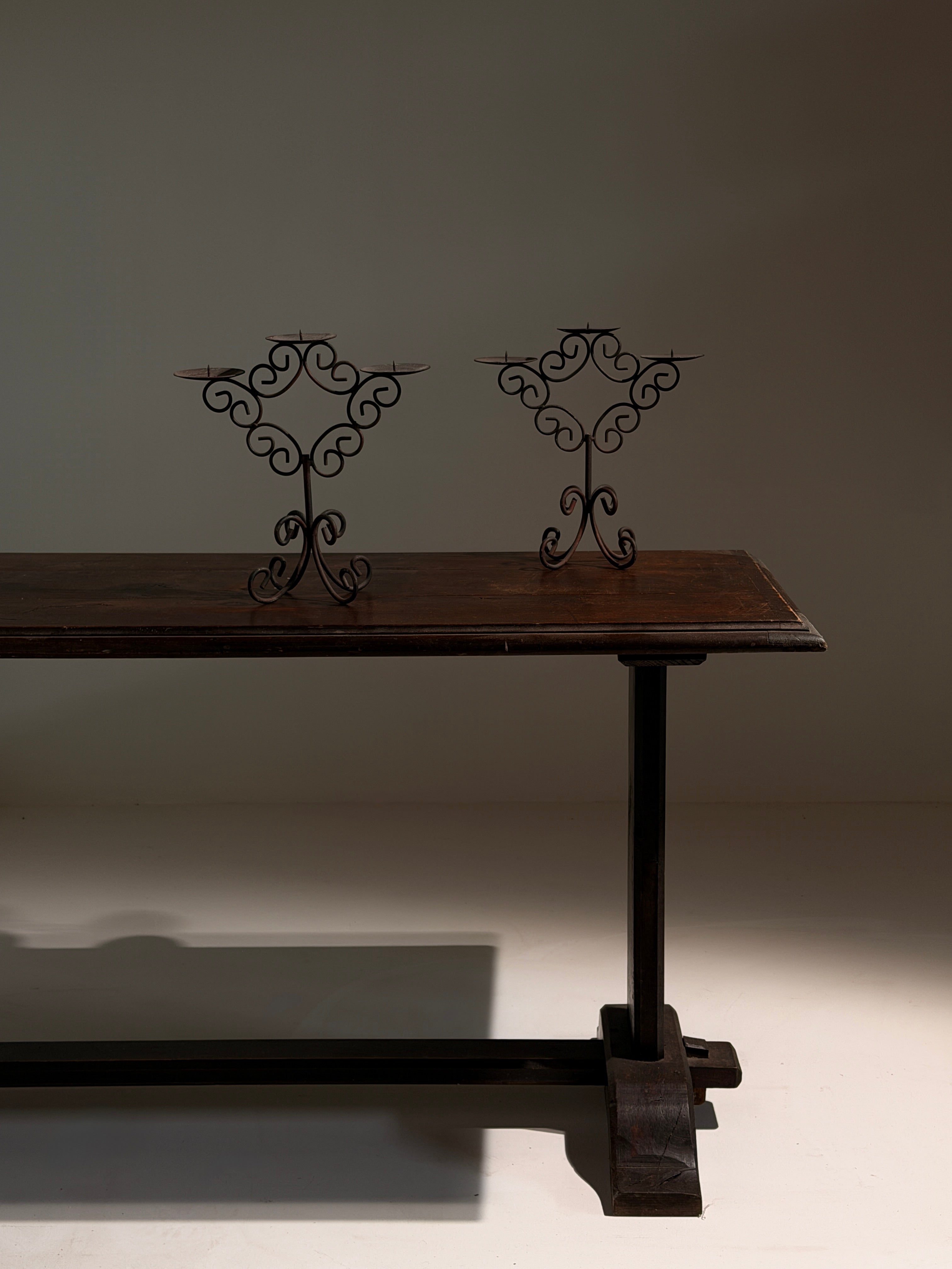 Pair of three-light wrought-iron candleholders, circa 1950 — detail view