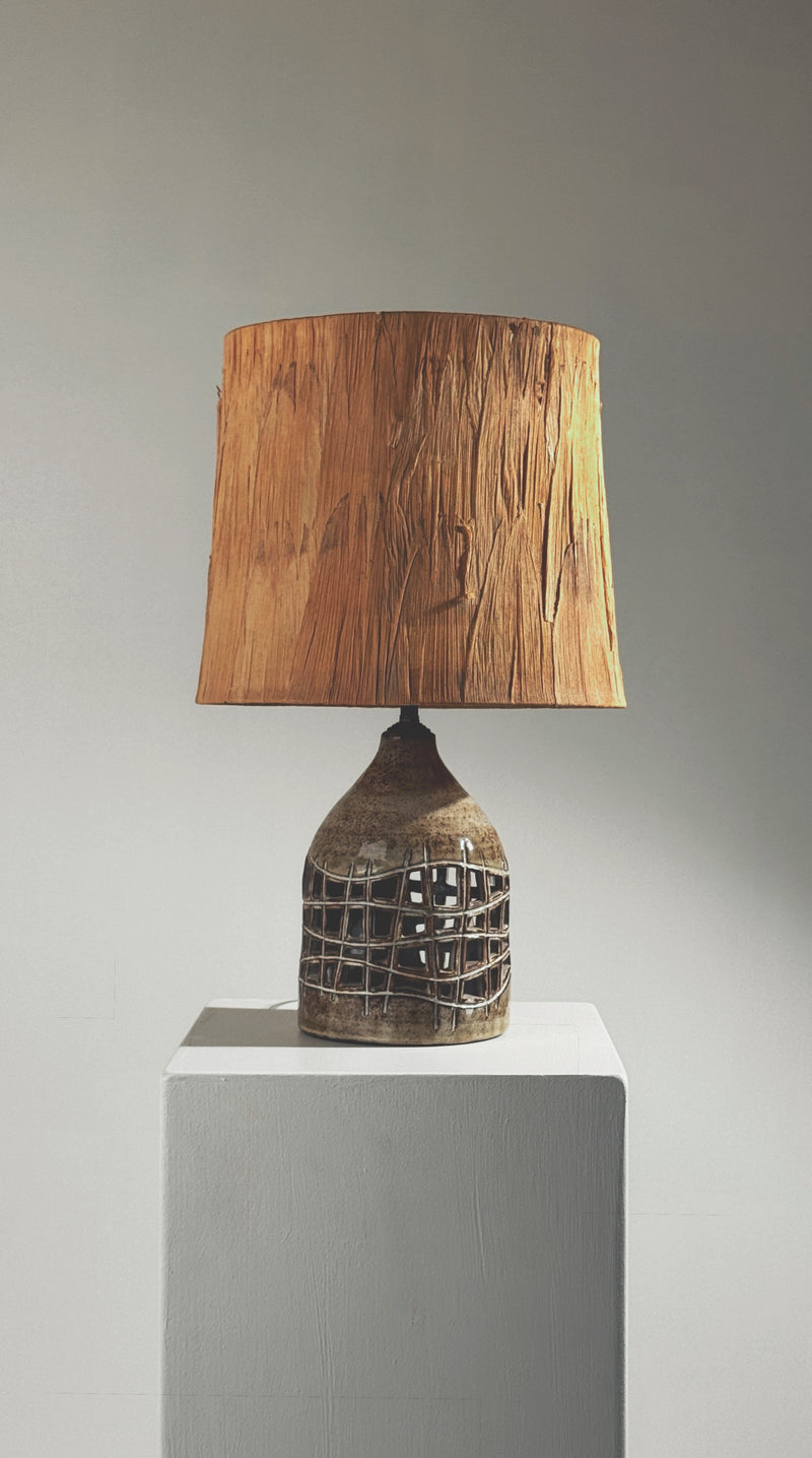 Pierced lamp by Robert Pérot, Vallauris, France, circa 1960 — close-up of textured ceramic base with wooden shade