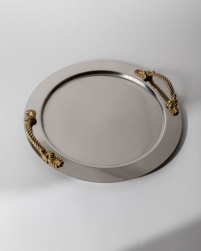 Vintage 1980s Stainless Steel Tray round, Gold Rope Handles by Inoxpran Italy — close-up of polished stainless steel surface