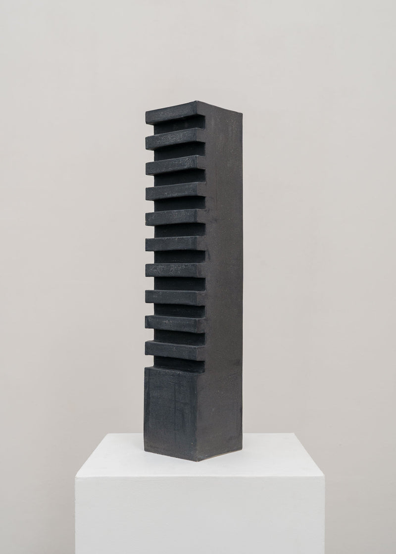 Tall Sculptural Stoneware Vessel by Tom Roberts — close-up of textured black surface