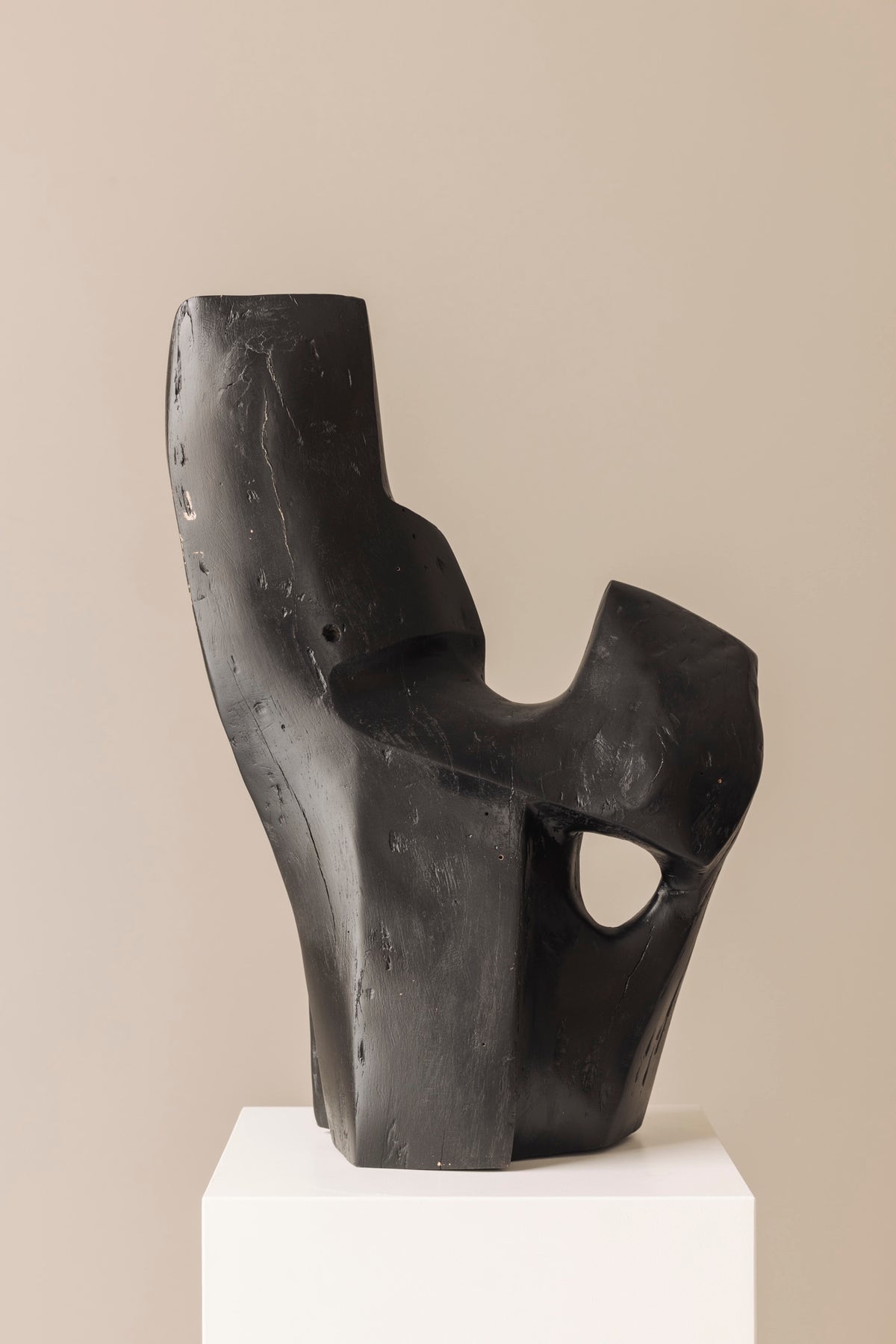 Abstract sculpture in solid dark stained wood dating from the 1950s. — lifestyle setting