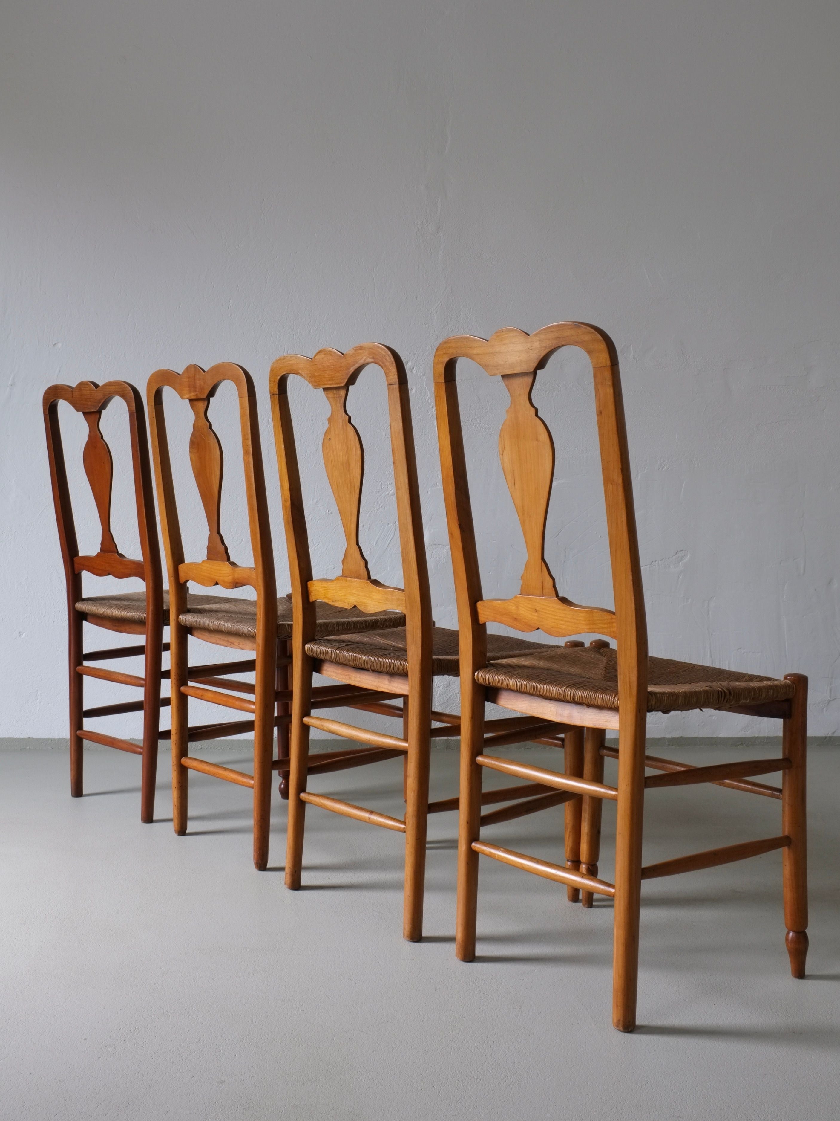 Rustic Rush Seat Chairs, Belgium 1940s — row of chairs against plain wall